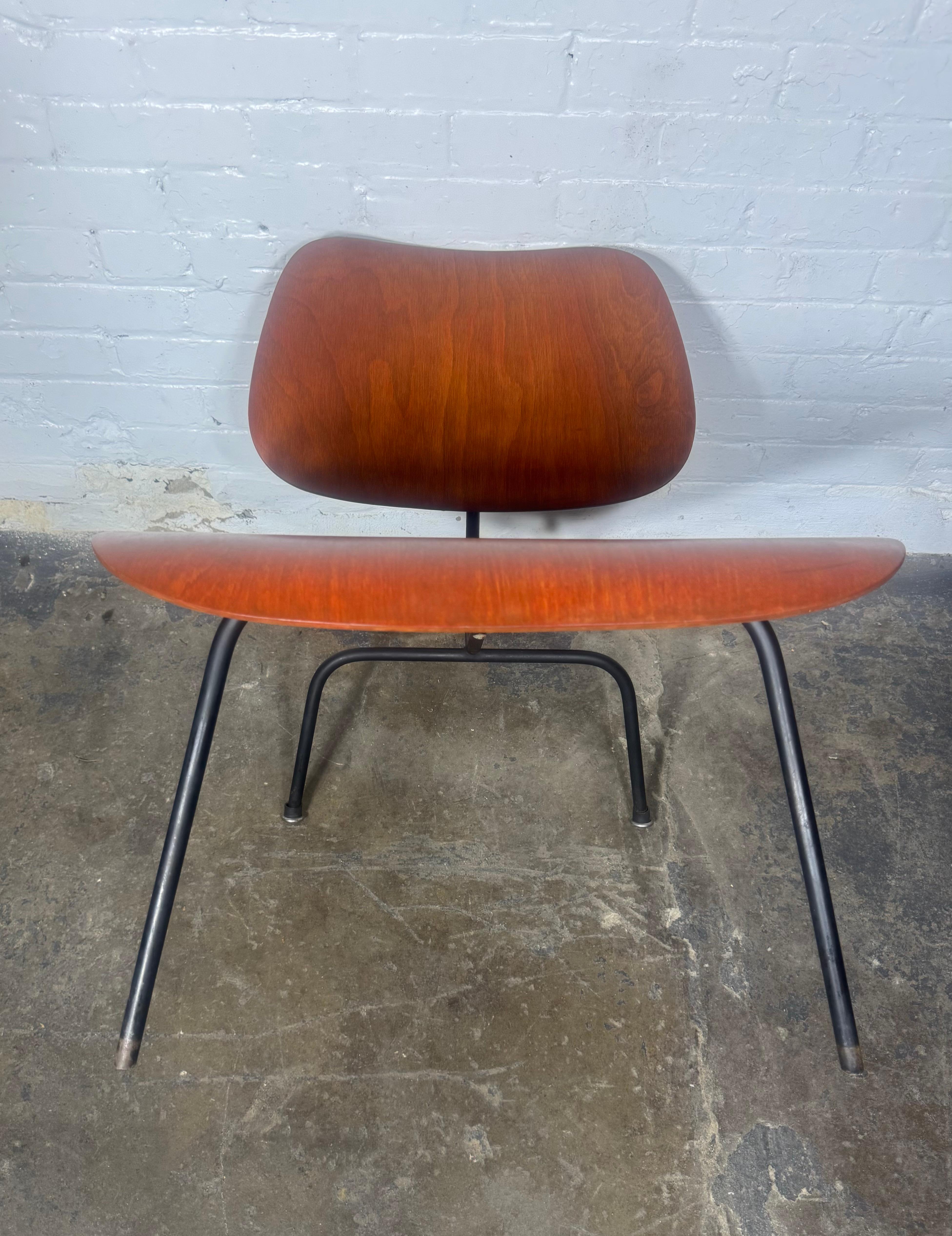 Early LCM red aniline dyed by Charles Eames for Herman Miller... Retains original patina.. minor repair to rear of seat (see photo), Stamped , Incised. L C M.  also dated 1953.. wonderful early example.. missing 2 feet glides.. easily replaceable 