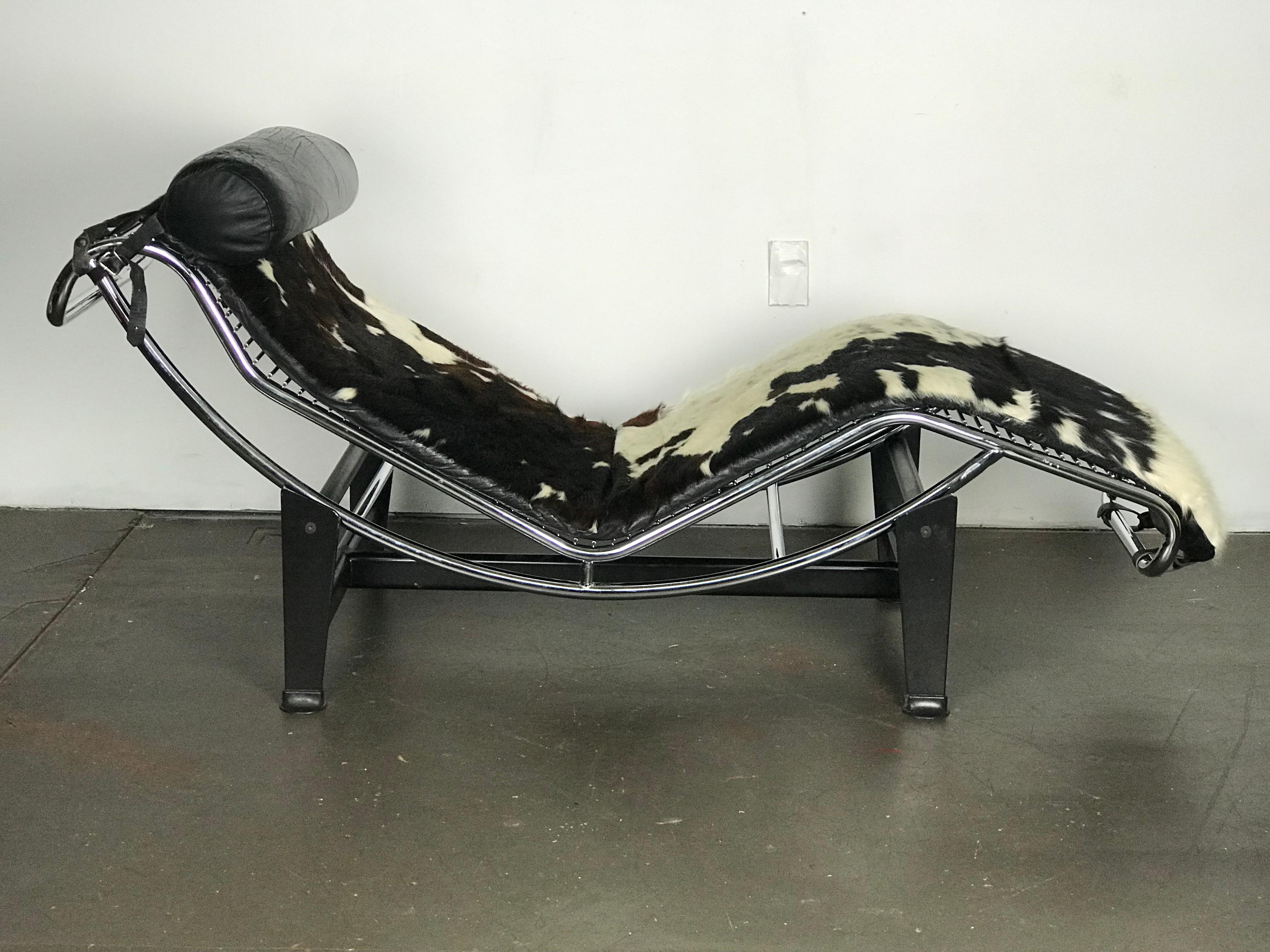 Nice early copy of Le Corbusier's iconic LC4 chaise in cowhide. The chaise is very nice with no issues to report. The chaise will move easily up and down on the frame and stick in its position. 
Measures: 69