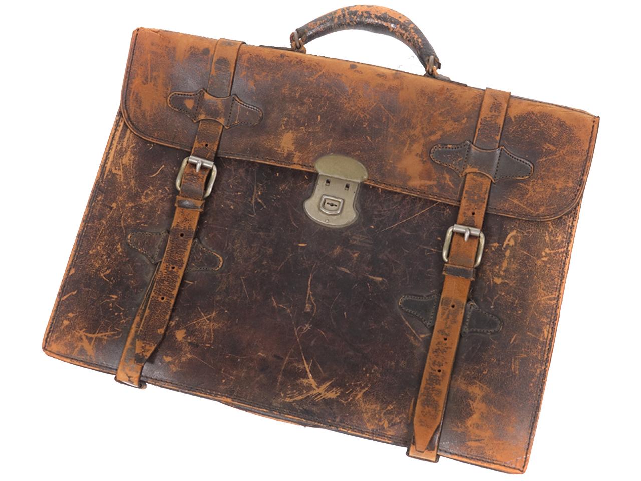 This is a delicate and early leather briefcase. The lock works and the leather straps are intact. There is no damage and it has just the right patina.