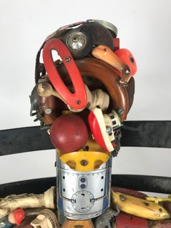 Primo assemblaggio di Leo Sewell, Scultura, Figura maschile seduta