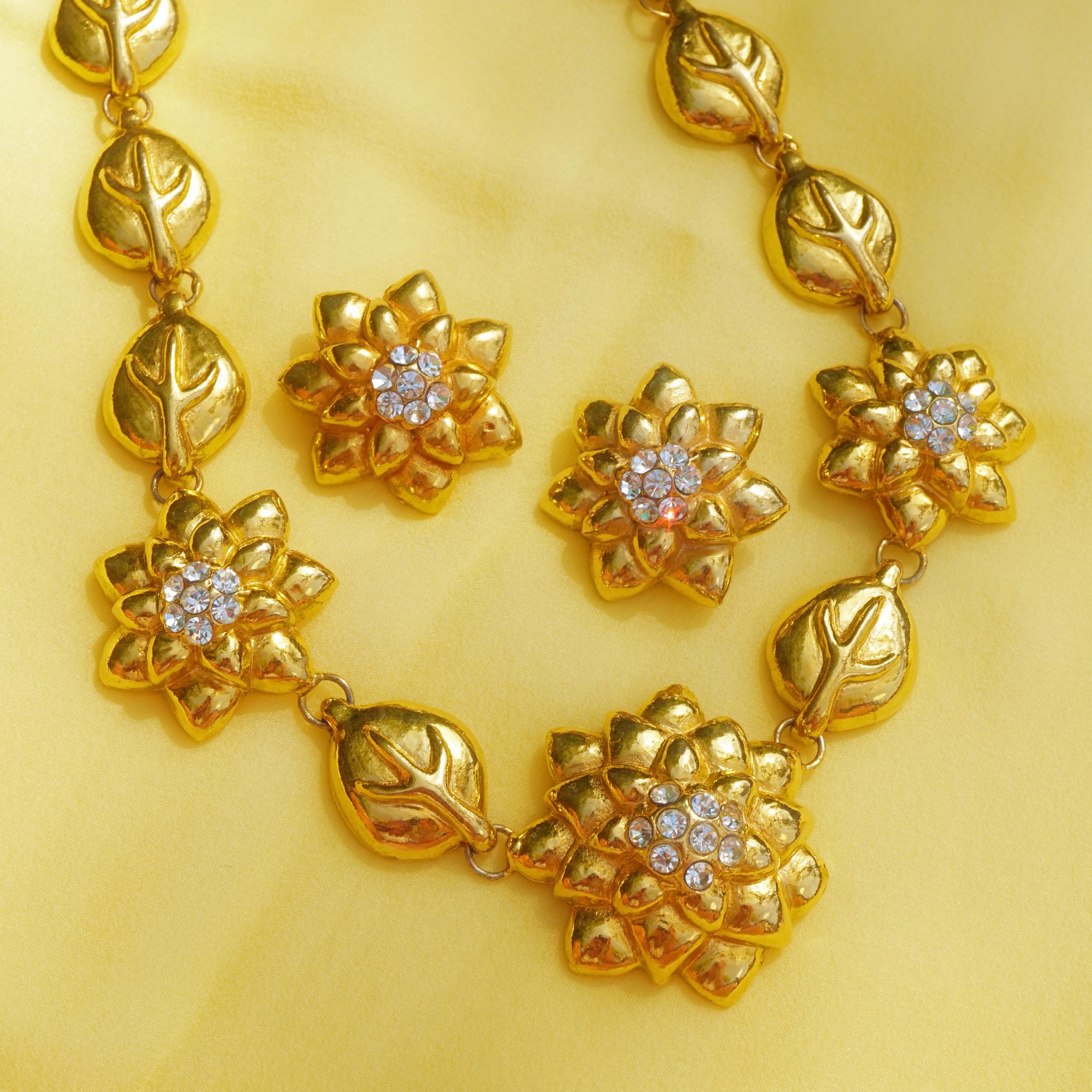 Important, immaculate and rare early Lorenz Baumer costume jewelry set featuring statement necklace and clip on earrings with floral motif.  This exceptional set was made prior to his illustrious career in fine jewelry,

- Necklace measures 18