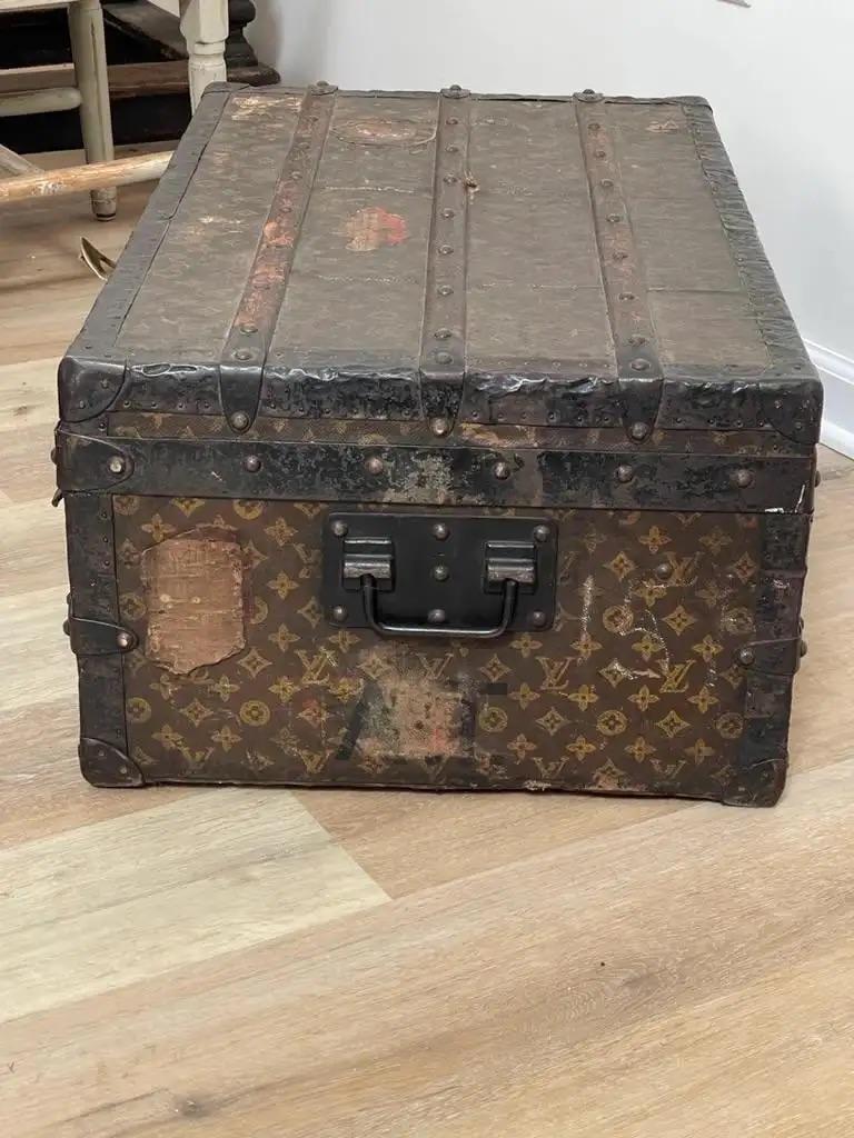 Early Louis Vuitton trunk, c. 1910, with LV insignia pattern having one interior tray, Monogram travel labels, Interior label, Rue Scribe Paris/Lille/149 New Bond St. London stamped 211667.
 