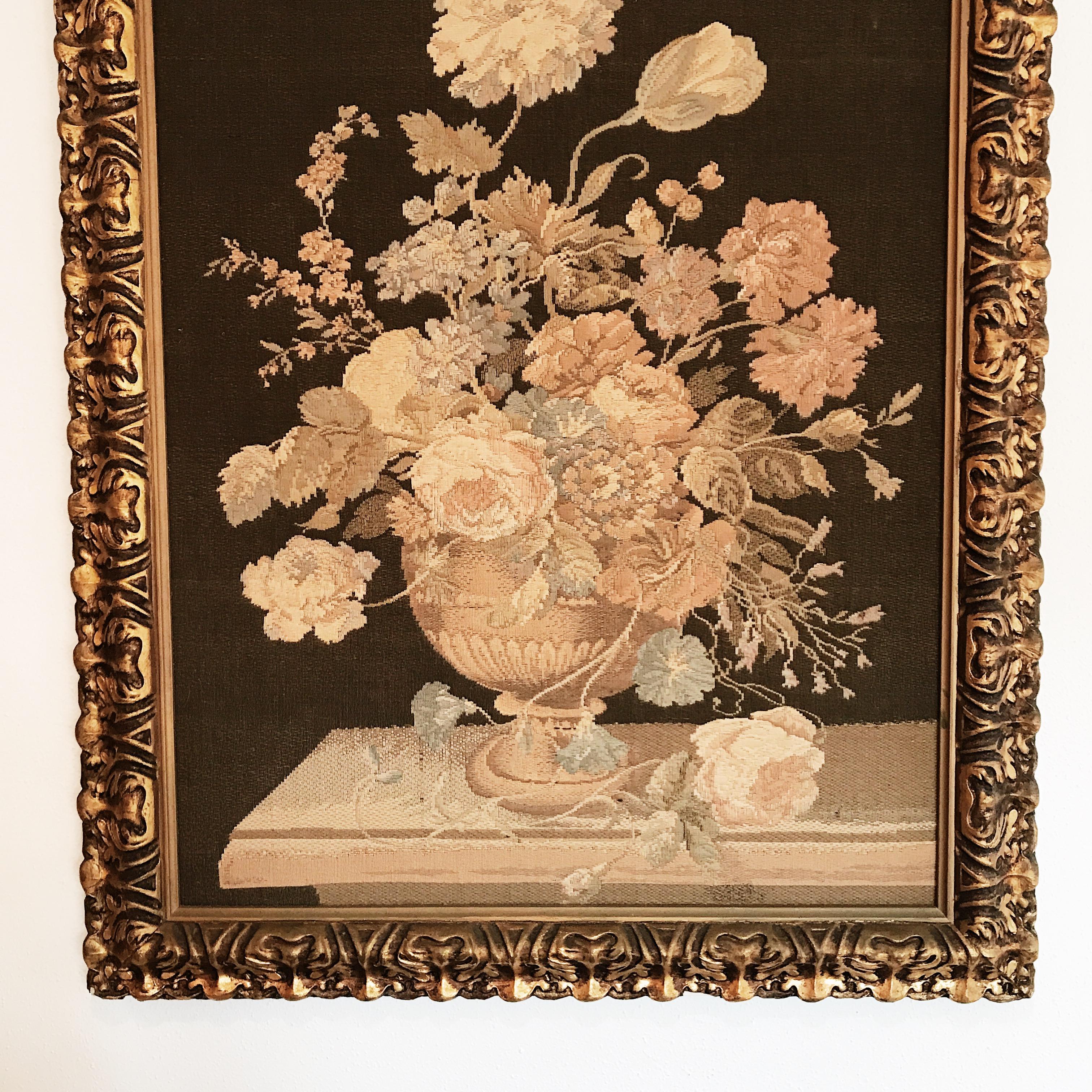 Early machine loom Italian floral still life tapestry in decorative mid-20th century Italian giltwood frame.
 