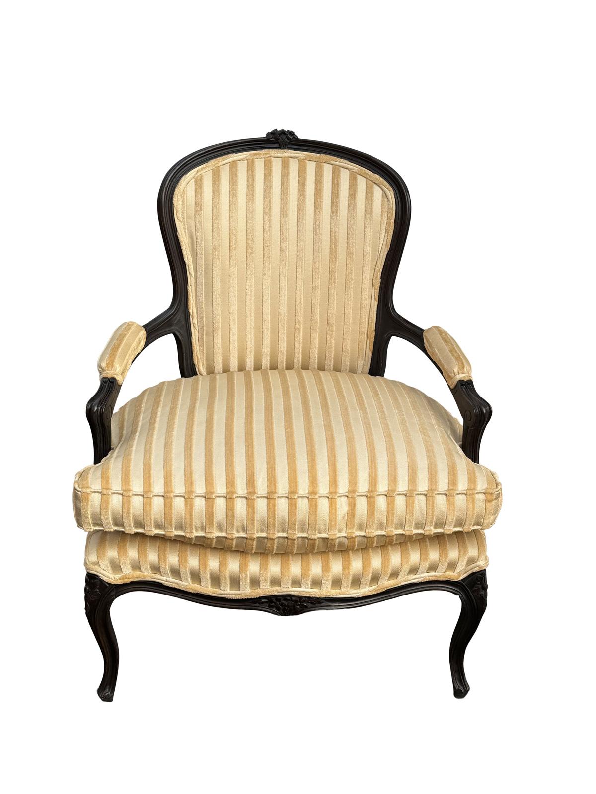 Beautiful pair of French style carved mahogany vintage chairs. These were definitely reupholstered with goosedown pillows very comfortable. Pleae feel free to reach out for any questions or additional pictures.