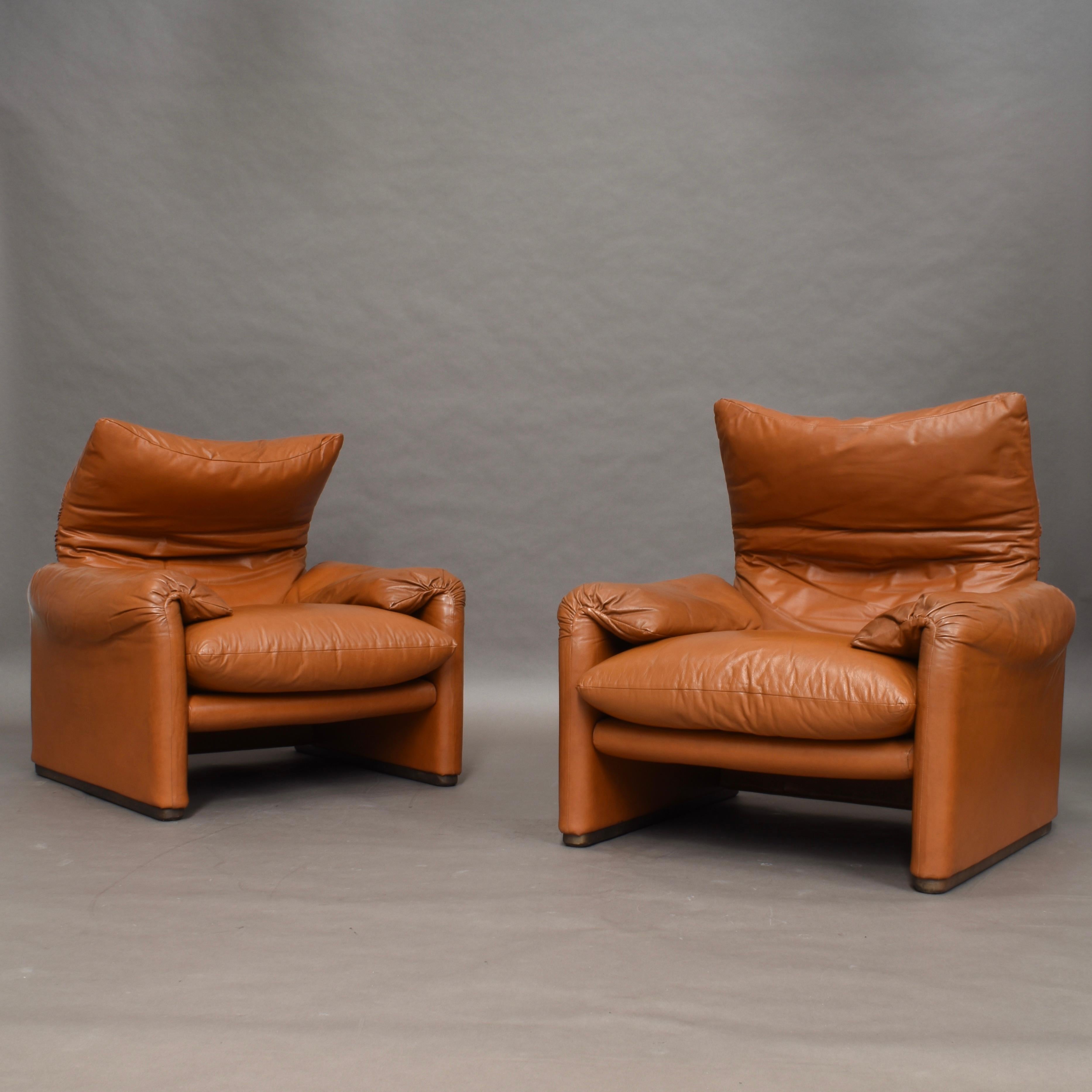 Very early edition Maralunga lounge chairs by Vico Magistretti for Cassina – 1973.

    

The chairs are made in tan colored leather with wood legs. The extractable head-rests work but the mechanisms are a bit weak. The leather has age related