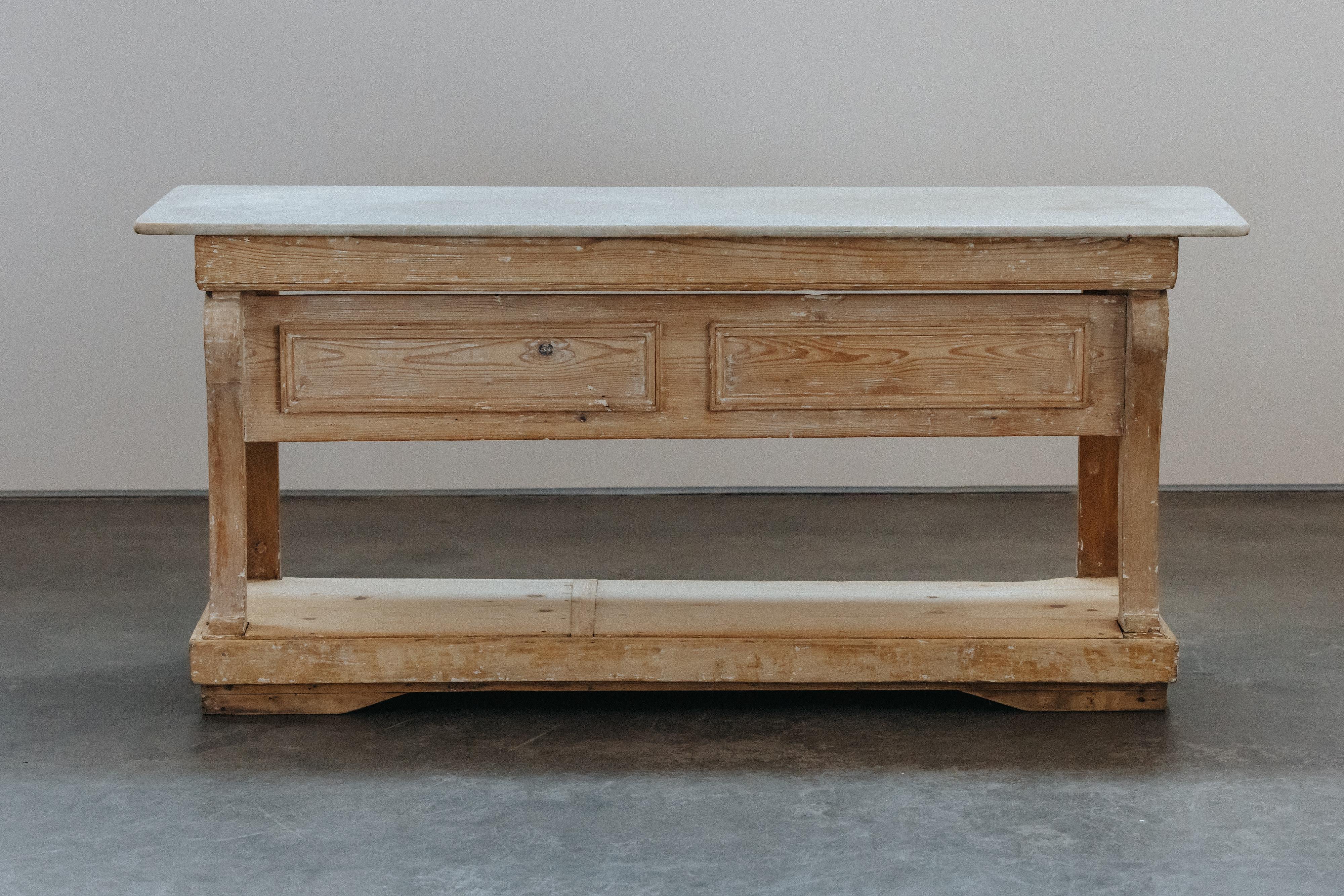 Early Marble Bakery Table From France, Circa 1850.  Solid pine construction with superb original color.  Original marble top.  Light wear and use.