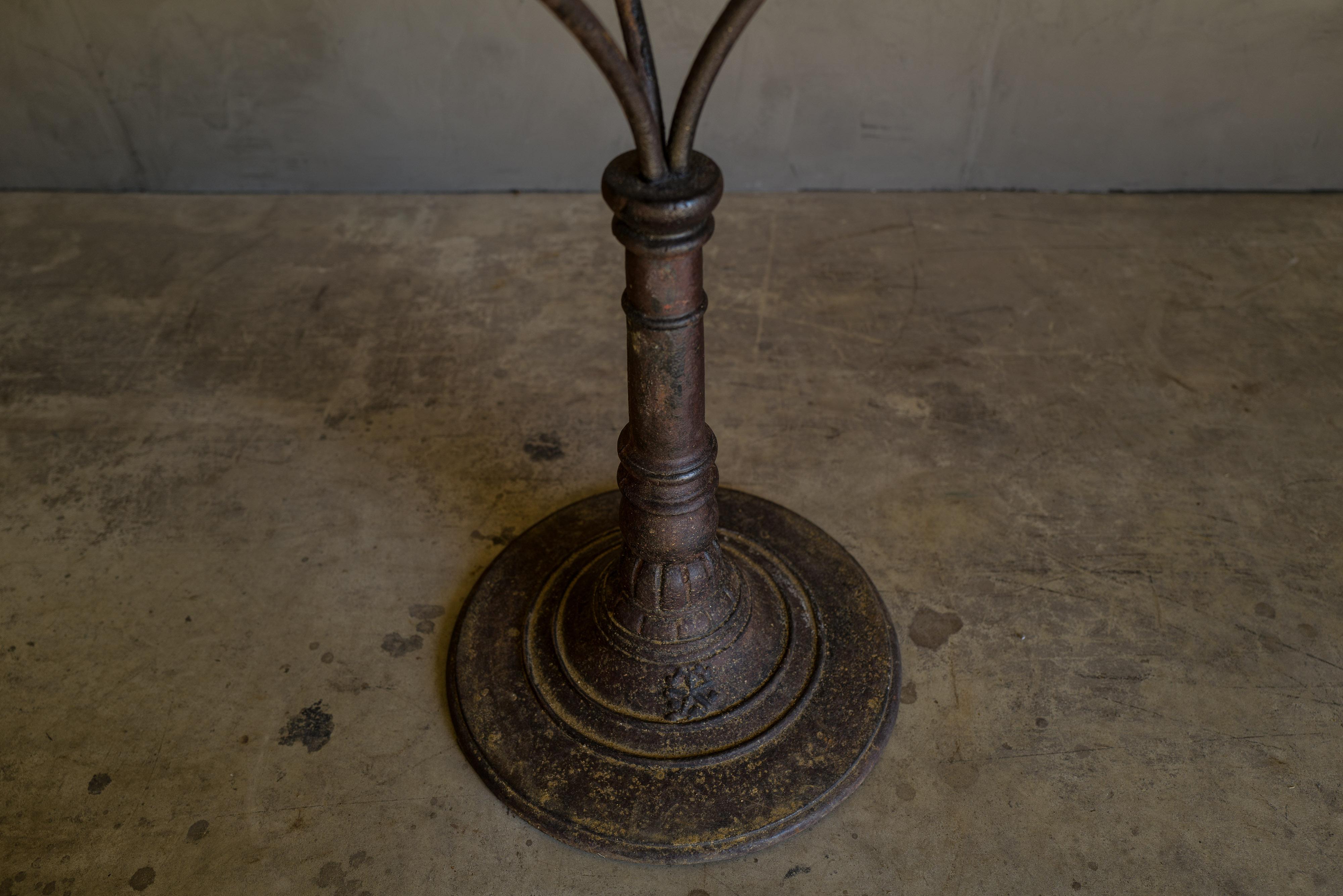 Early marble bistro table from France, circa 1940. Cast iron base with a marble top and copper edge. Fantastic original patina and wear.

  