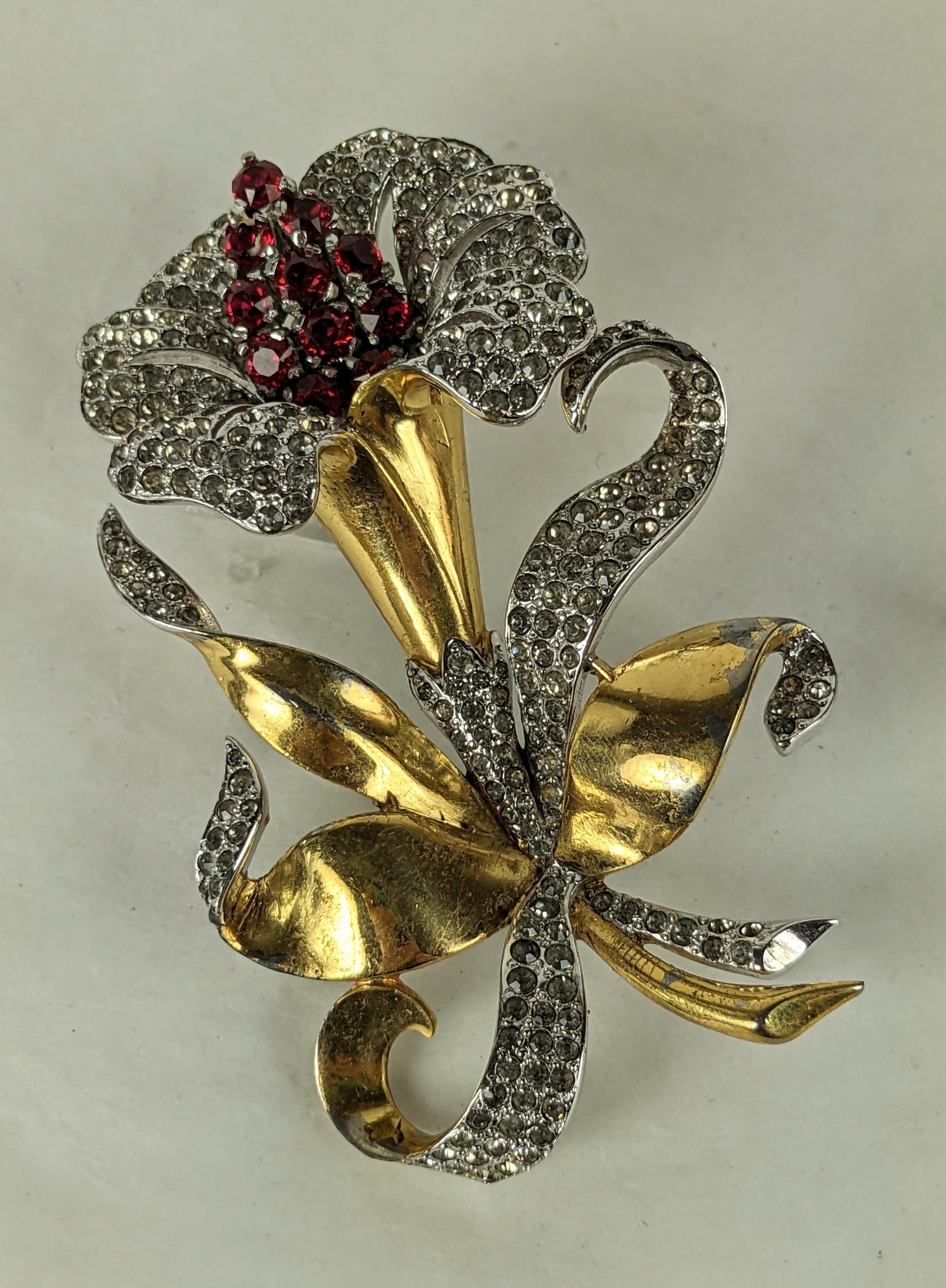 Early Marcel Boucher Ruby Lily from the 1930's. Large striking floral spray with pave accents and ruby paste center. 1930's USA. Signed. 3.25
