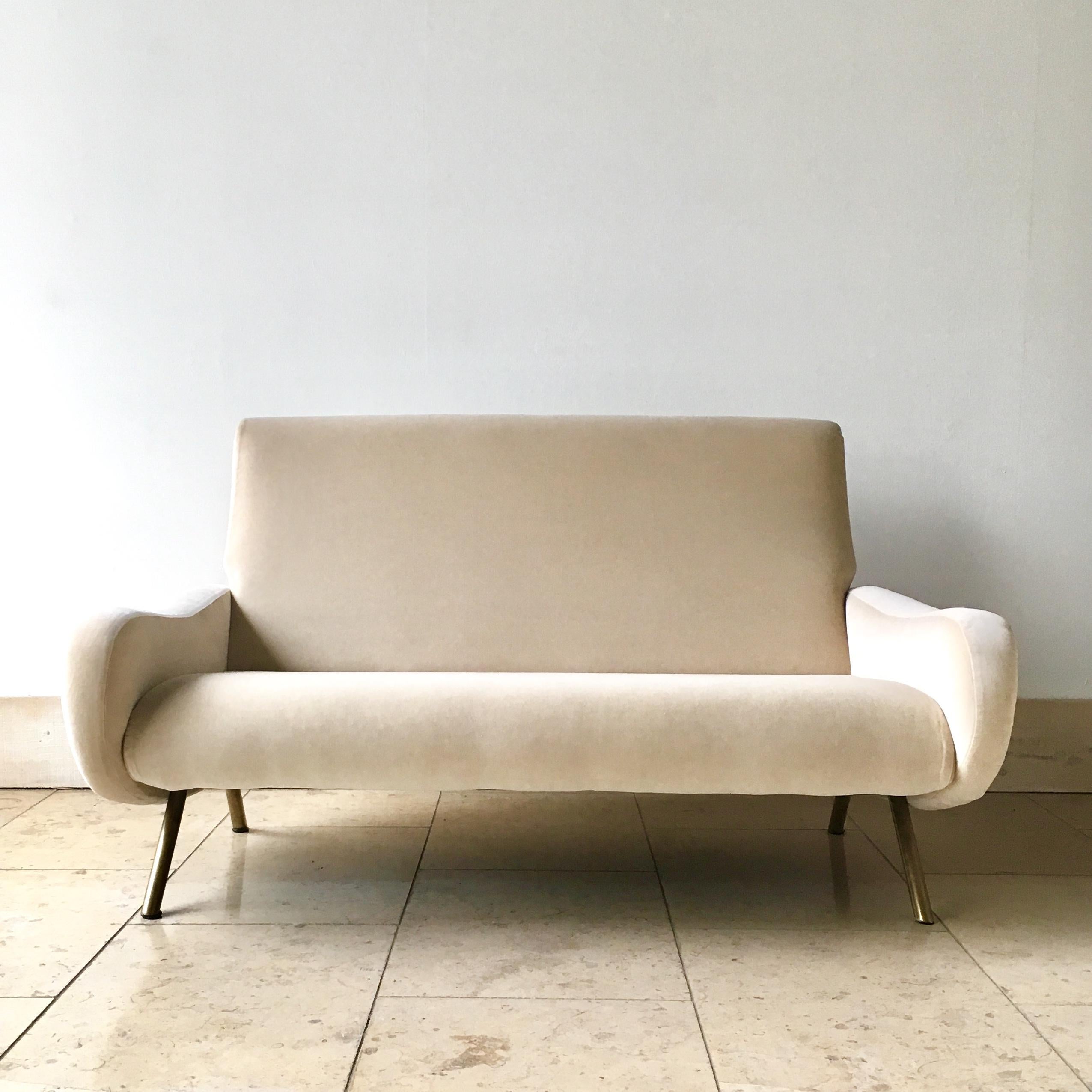 An early production two seater sofa model 'Lady' designed by Marco Zanuso for Arflex Edition 1951 set on brass tubular legs.


Marco Zanuso was an Italian architect and designer who worked with Arflex during the early 1950s designing furniture
