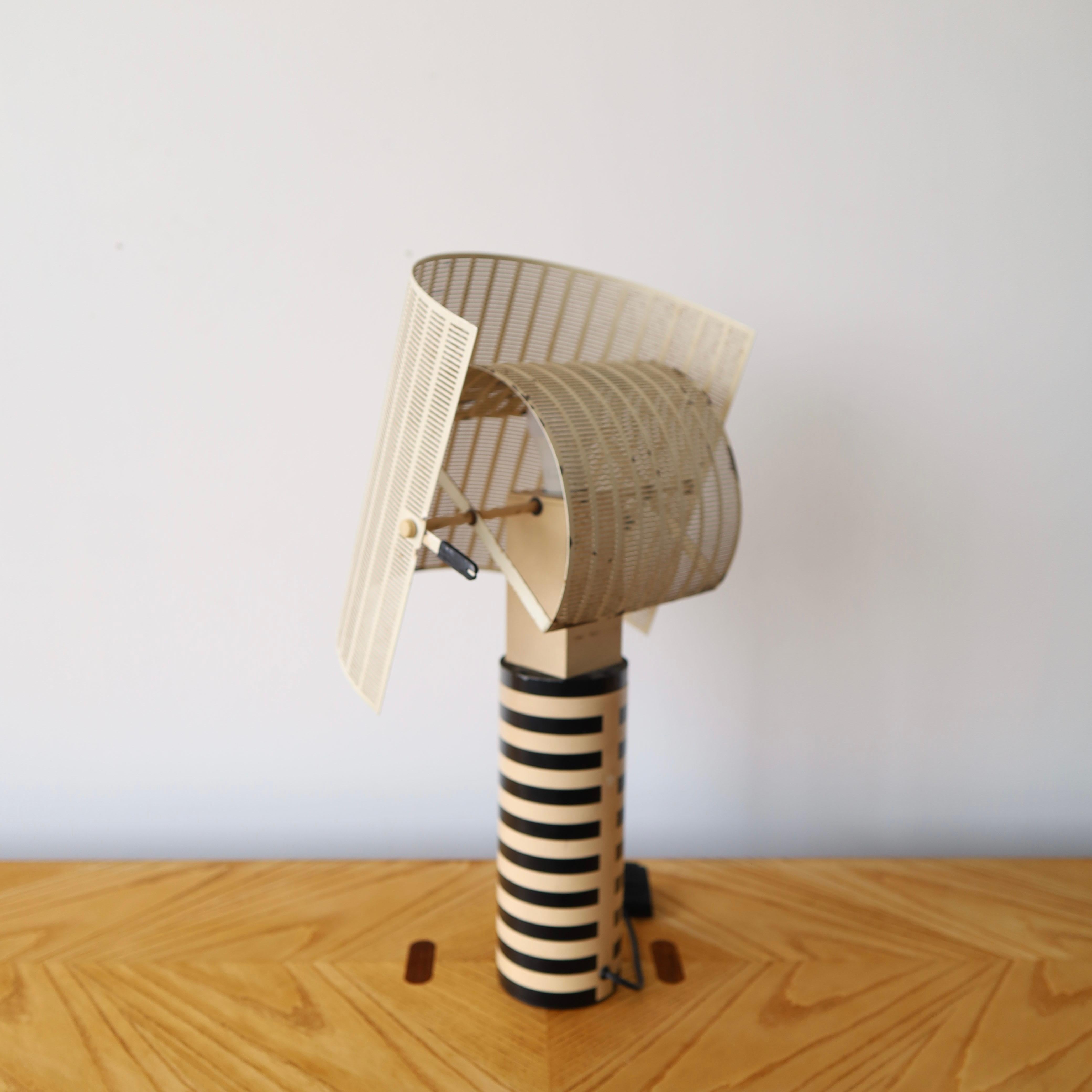 ft. a moving shade that affects the distribution of light. It has a European plug but comes with an adapter. This piece has HEAVY patina including paint flaking, scratches, rust, and scuffs. We love it, but it’s not for everyone

