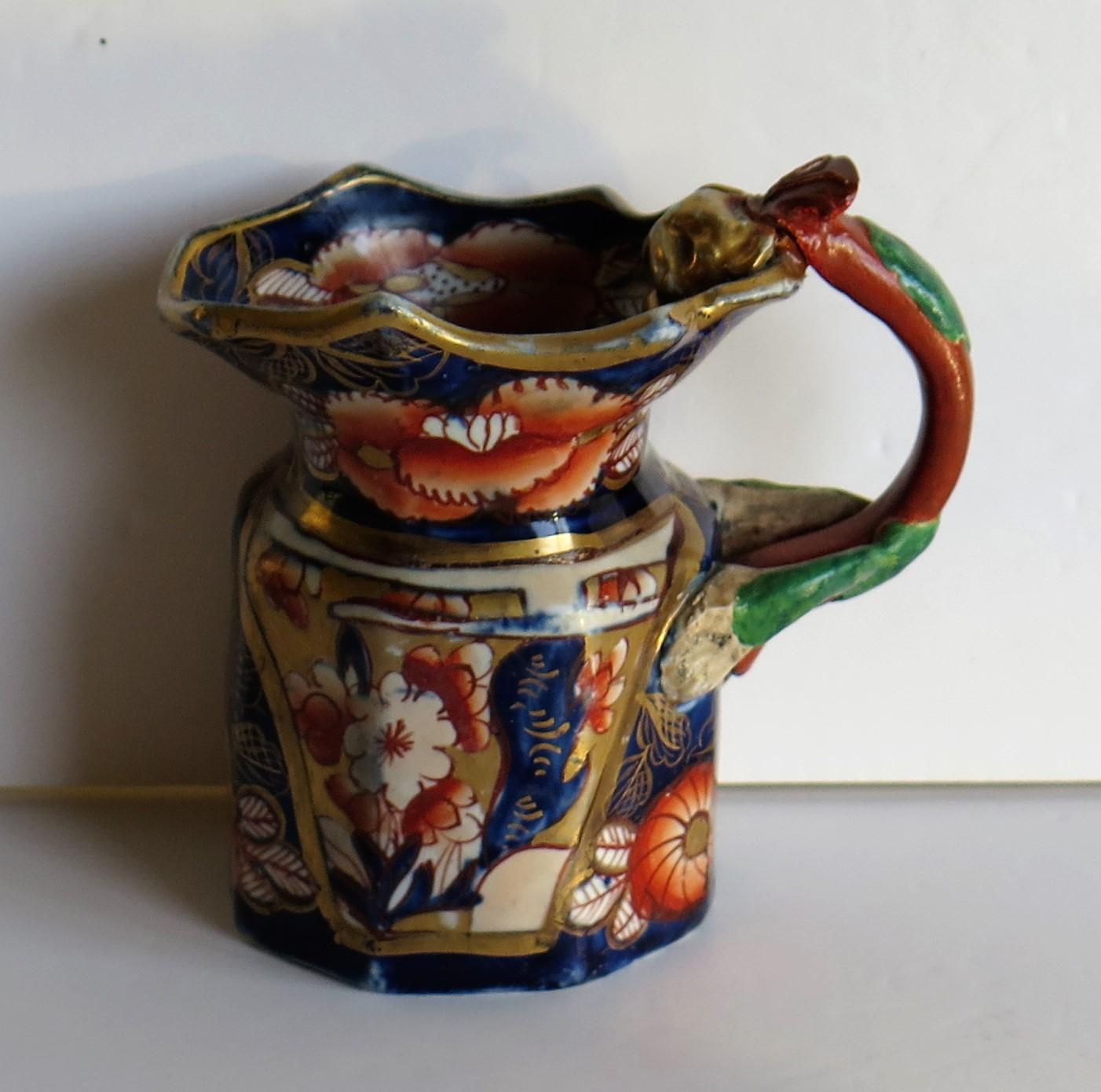 This is a fine and rare, small ironstone pottery cream jug or pitcher in the School House pattern, made by Mason's Ironstone, of Lane Delph, Staffordshire, England, circa 1820

The jug is octagonal in form with the 