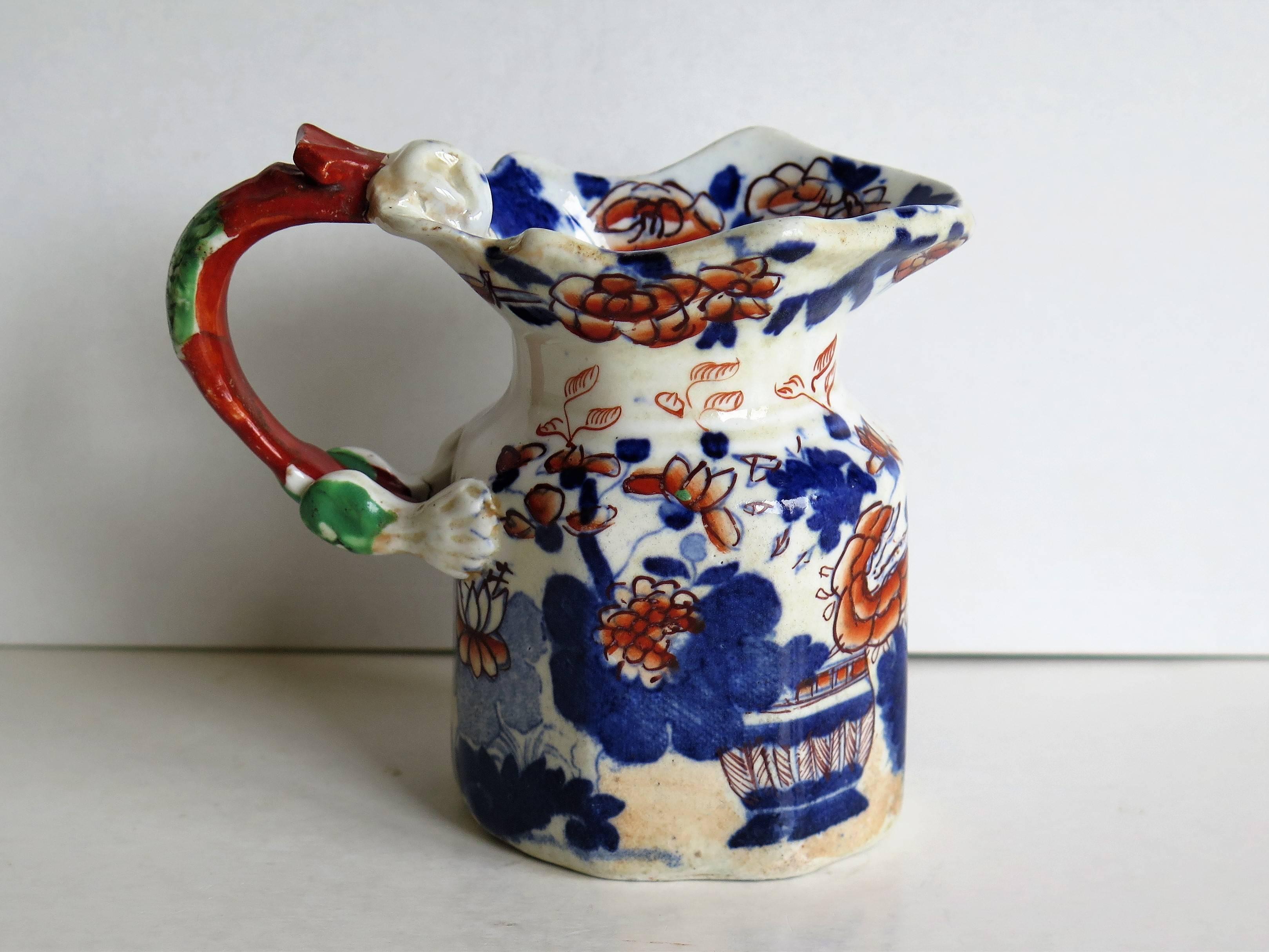 This is a very decorative, early Mason's Ironstone cream jug or pitcher, made at their Lane Delph factory, Staffordshire Potteries, England, in the early 19th century, circa 1825.

This jug has the 