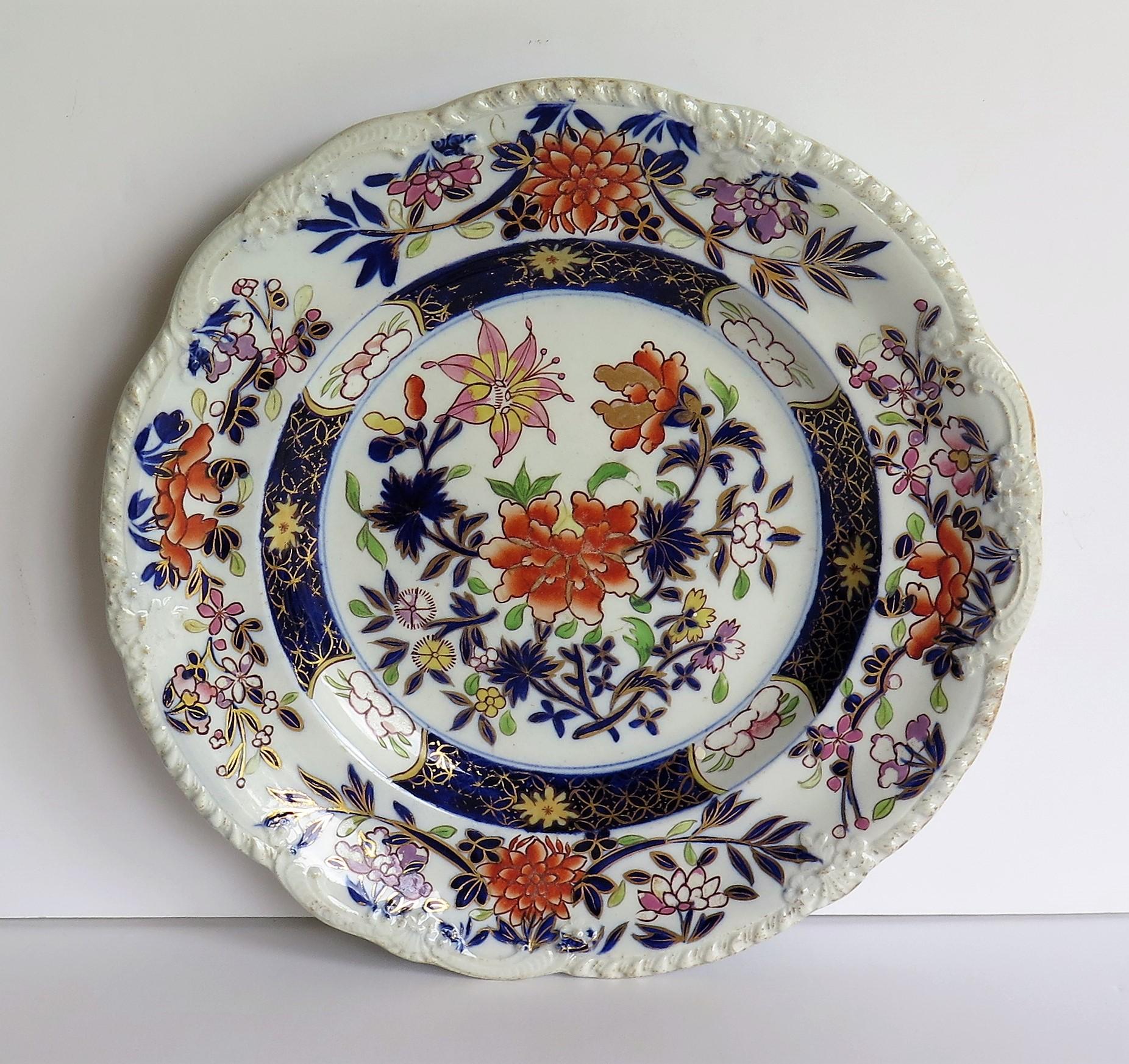 This is a very decorative Mason's Ironstone pottery Desert Plate produced by the Mason's factory at Lane Delph, Staffordshire, England, circa 1815-1820.

The plate is circular with a shaped rim having a moulded edge design.

The plate is