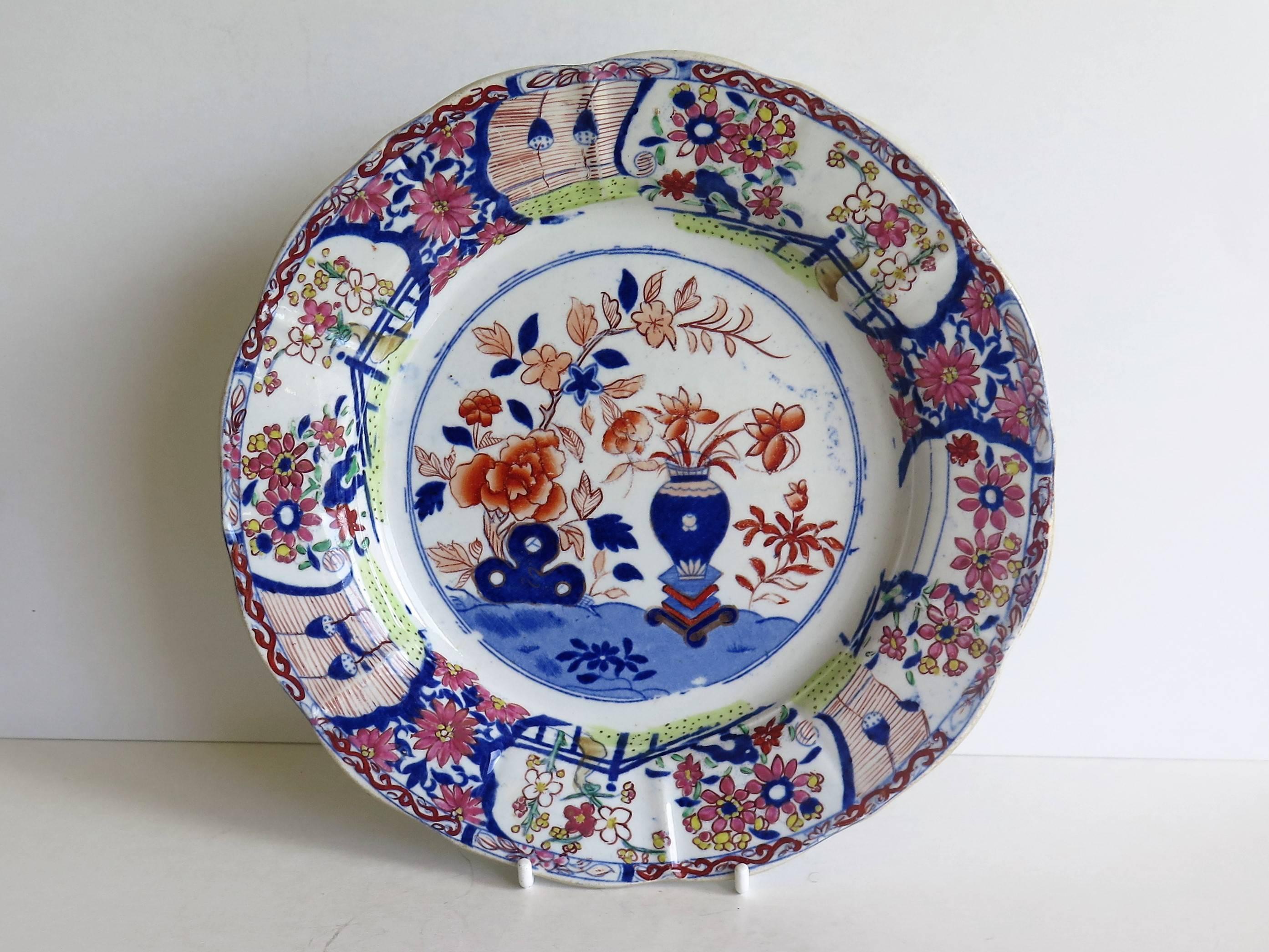 This is a very decorative ironstone pottery desert plate or dish produced by the Mason's factory at Lane Delph, Staffordshire, England, circa 1815.

The plate is circular with radial ribs and a lobed rim.

This desert plate is beautifully and