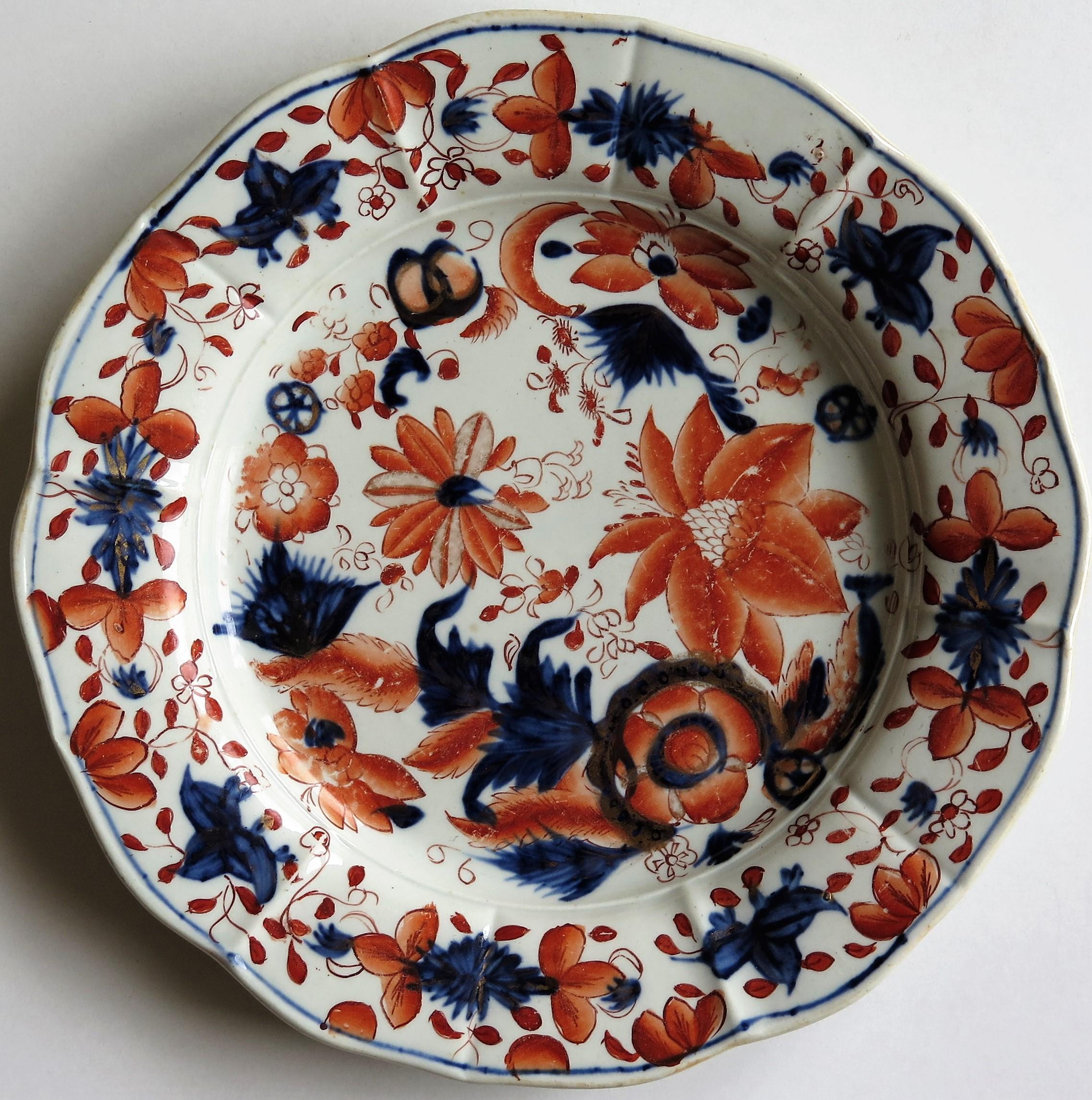 This is a good decorative Ironstone pottery desert plate or dish produced by the Mason's Factory at Lane Delph, Staffordshire, England, circa 1815.

The plate is circular with radial ribs and a lobed rim.

This desert plate is beautifully decorated