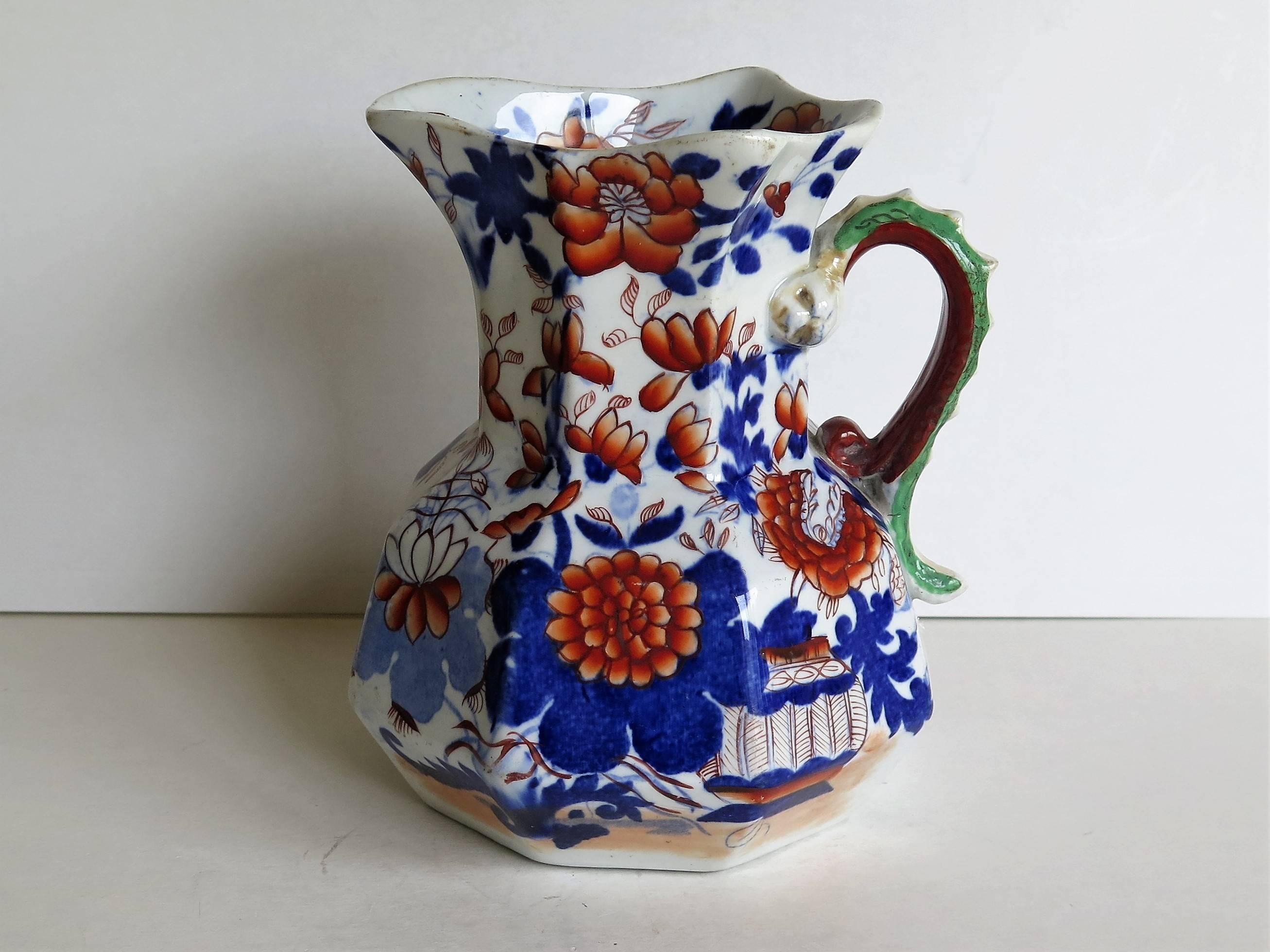This is a very good, early Mason's Ironstone hydra jug in the Japan Basket pattern, circa 1820. 

The jug has an octagonal shape with a notched snake handle and is decorated in the distinctive Japan Basket pattern, which is one of Mason's well