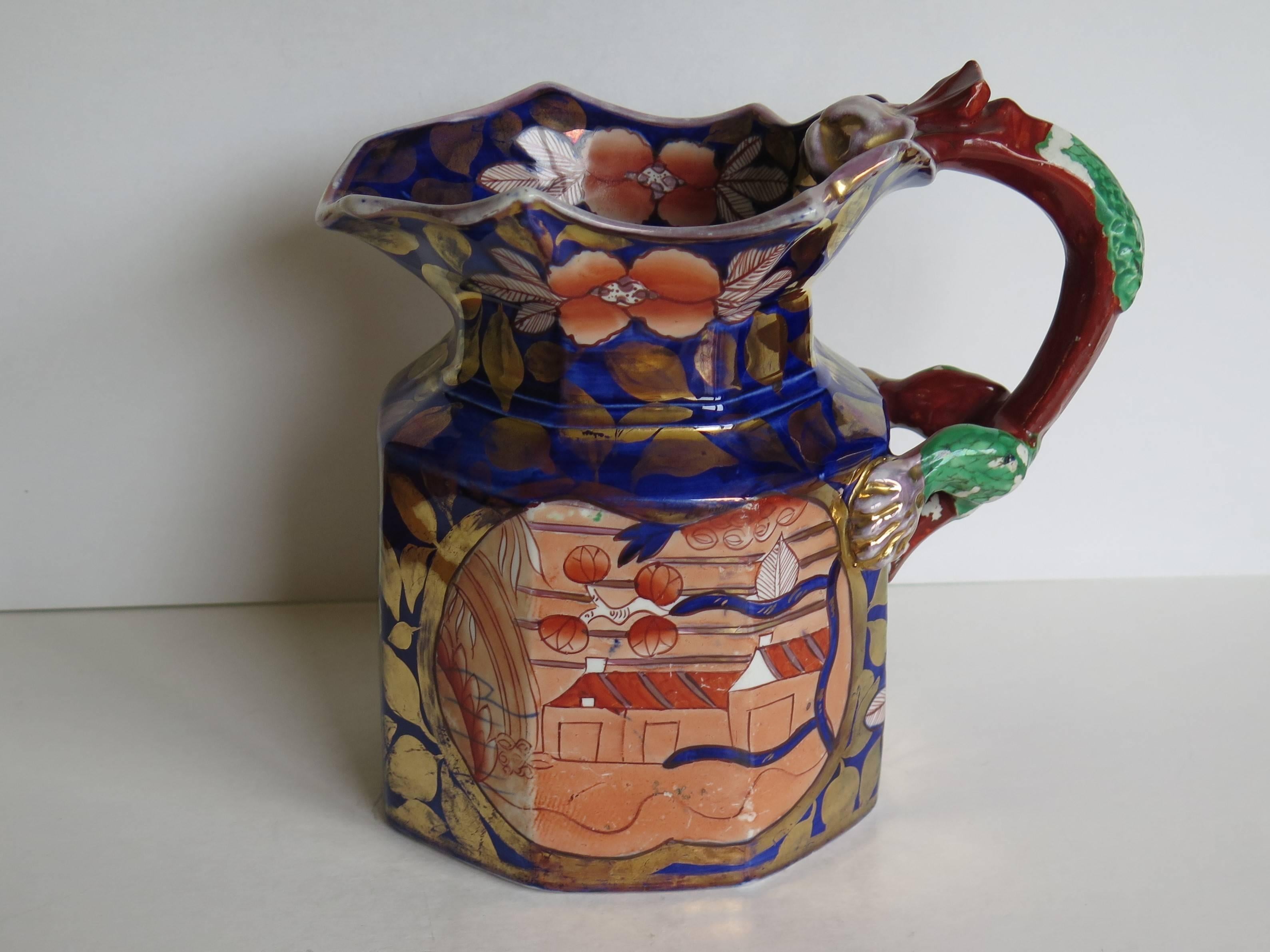 This is a fine and rare, large ironstone pottery jug or pitcher in the Fenton shape made by Mason's Ironstone, of Lane Delph, Staffordshire, England, circa 1820

The jug is octagonal with a dragon loop handle. The piece is profusely and richly hand-