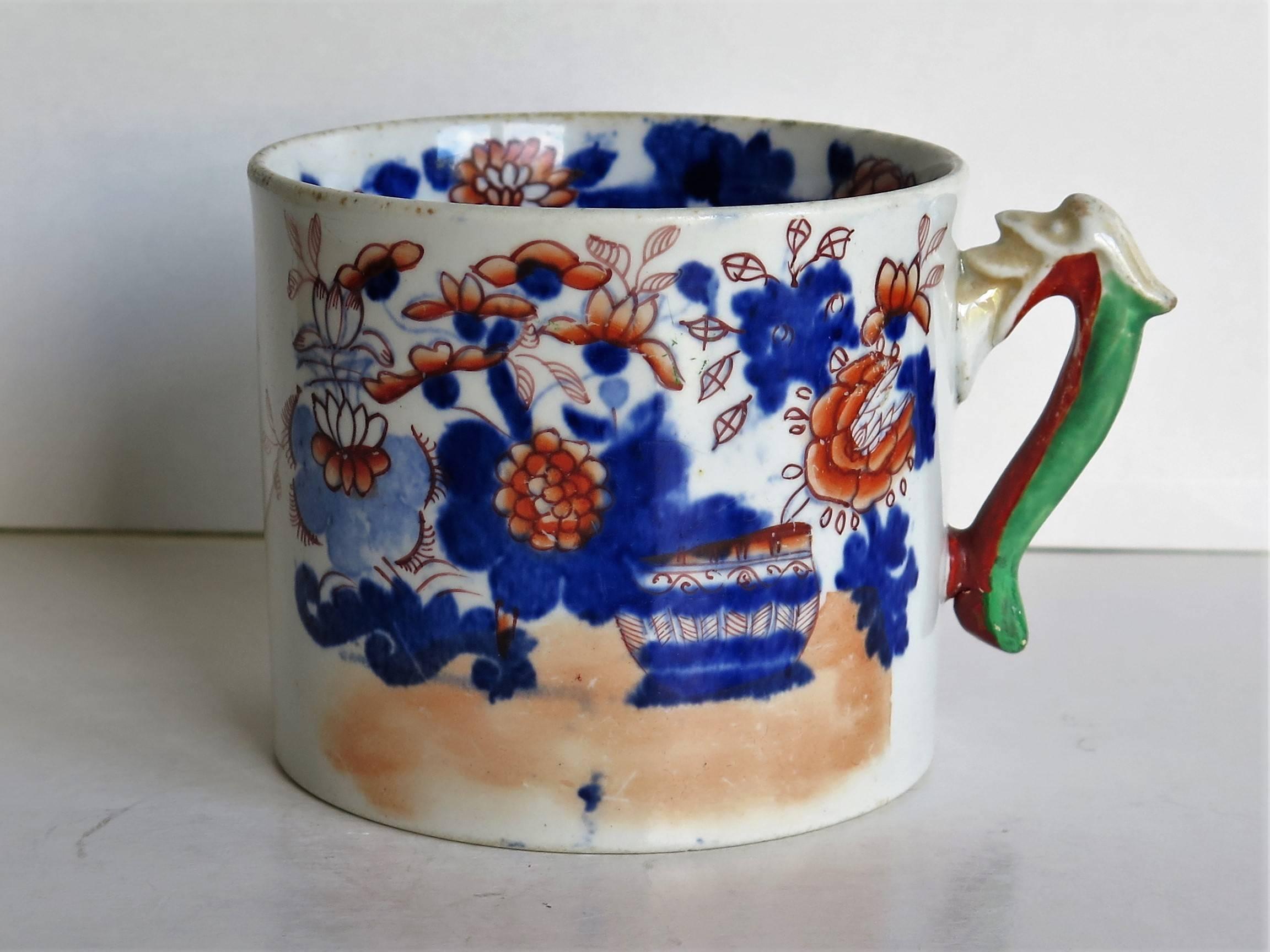 This is a good early English Mason's ironstone mug dating to the late Georgian period, circa 1818.

Mason's Ironstone mugs tend to be rare and are harder to find.

The mug is cylindrical with a slight taper and has a dolphin loop handle. It is