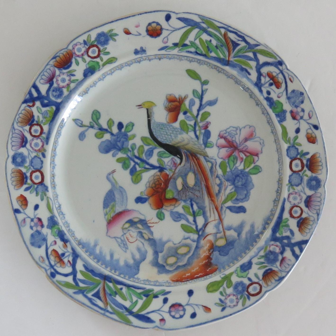This is a very decorative Side Plate by Mason's Ironstone, Lane Delph, England in the Oriental Pheasant pattern, dating to the early period of Mason's ironstone, circa 1818.

The plate is circular in shape with a notched rim and is decorated in
