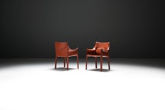 Poltrone Cab 413 (2) in pelle di Mario Bellini per Cassina.