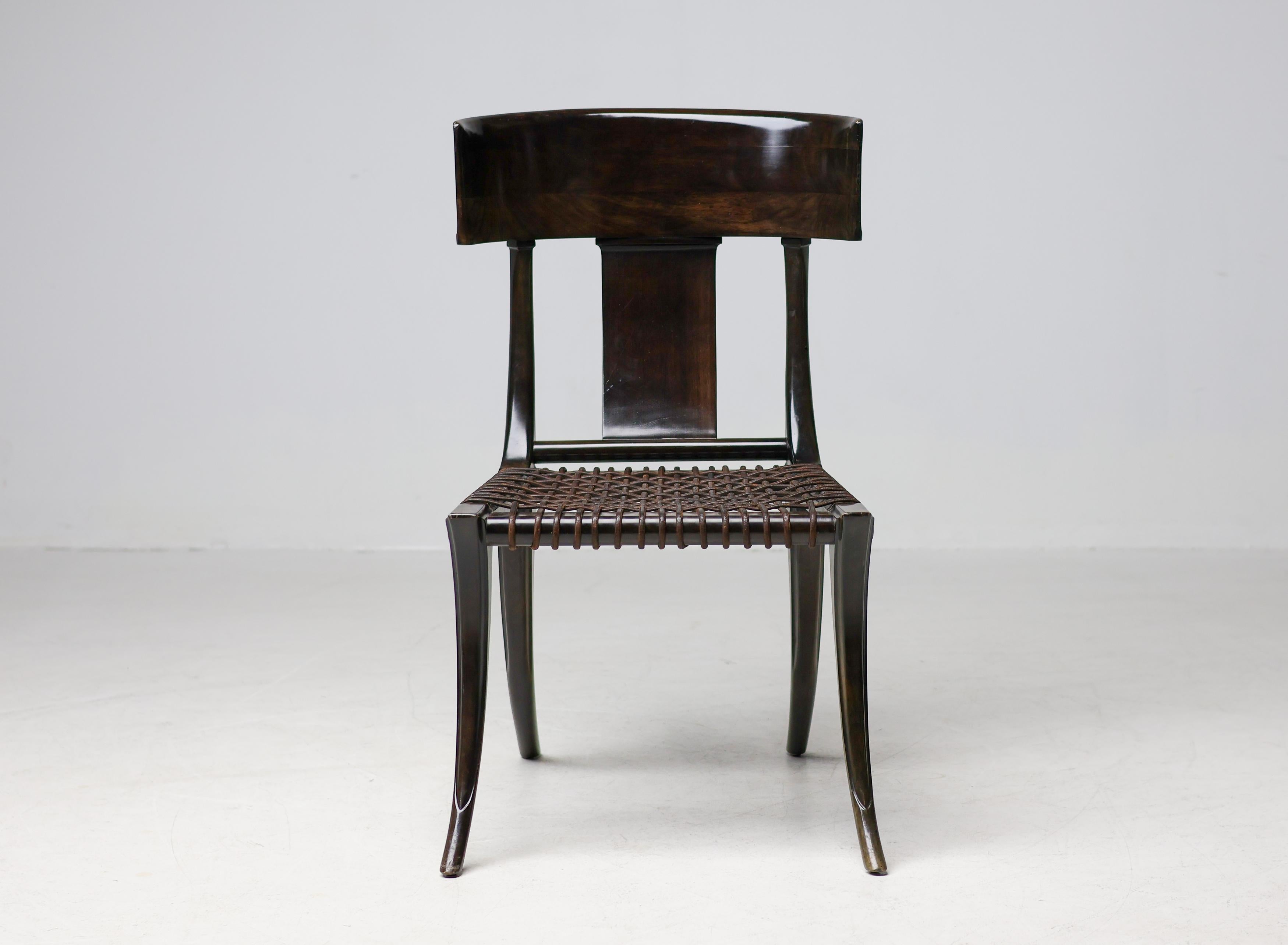 Exceptional pair of early Klismos chairs by T.H. Robsjohn-Gibbings for Saridis of Athens, crafted in dark-stained walnut and retaining their original character and authenticity throughout. These early examples feature the hallmark metal Saridis