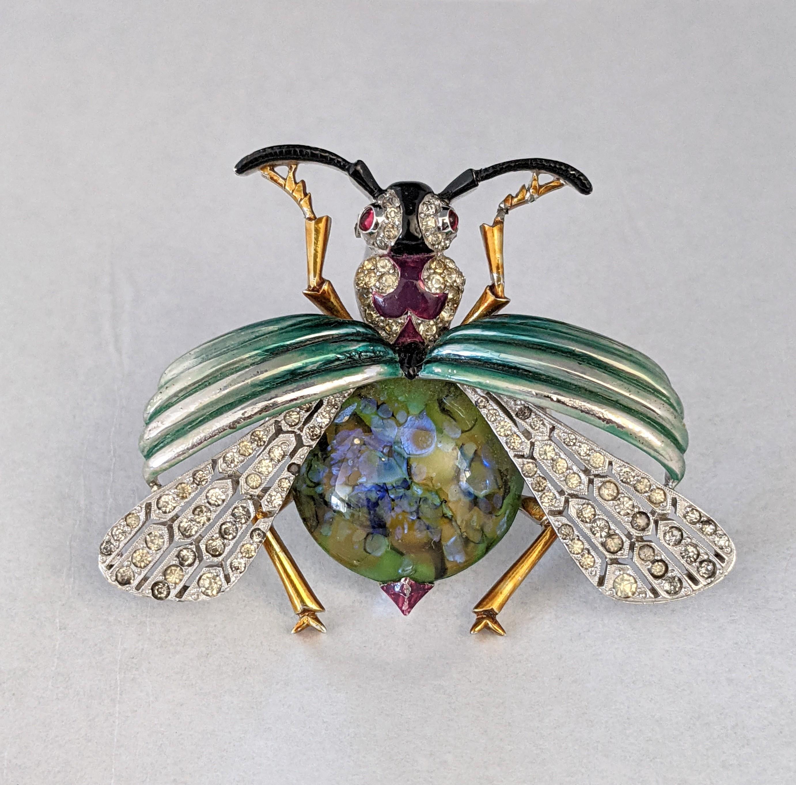 Early and Exceptional Art Deco Mazer Enamel and Pave Bee Clip Brooch set in rhodium plated metal with iridiscent enamels and glass ruby cab eyes. The body is an unusual Art glass peacock cabochon with a play of light similar to an opal.