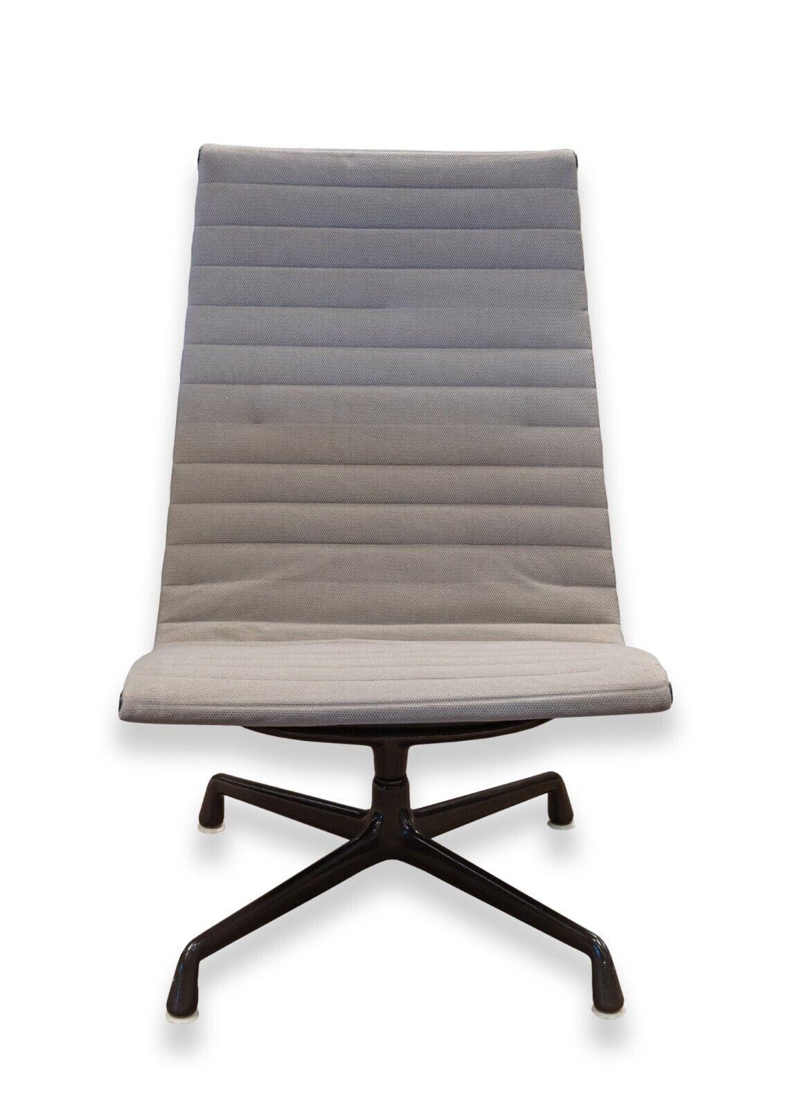 An early mid century modern Eames for Herman Miller aluminum group swivel chair. A super iconic piece from Eames and Herman Miller featuring a full aluminum frame construction, a super soft grey fabric upholstery, and a super smooth swiveling base.