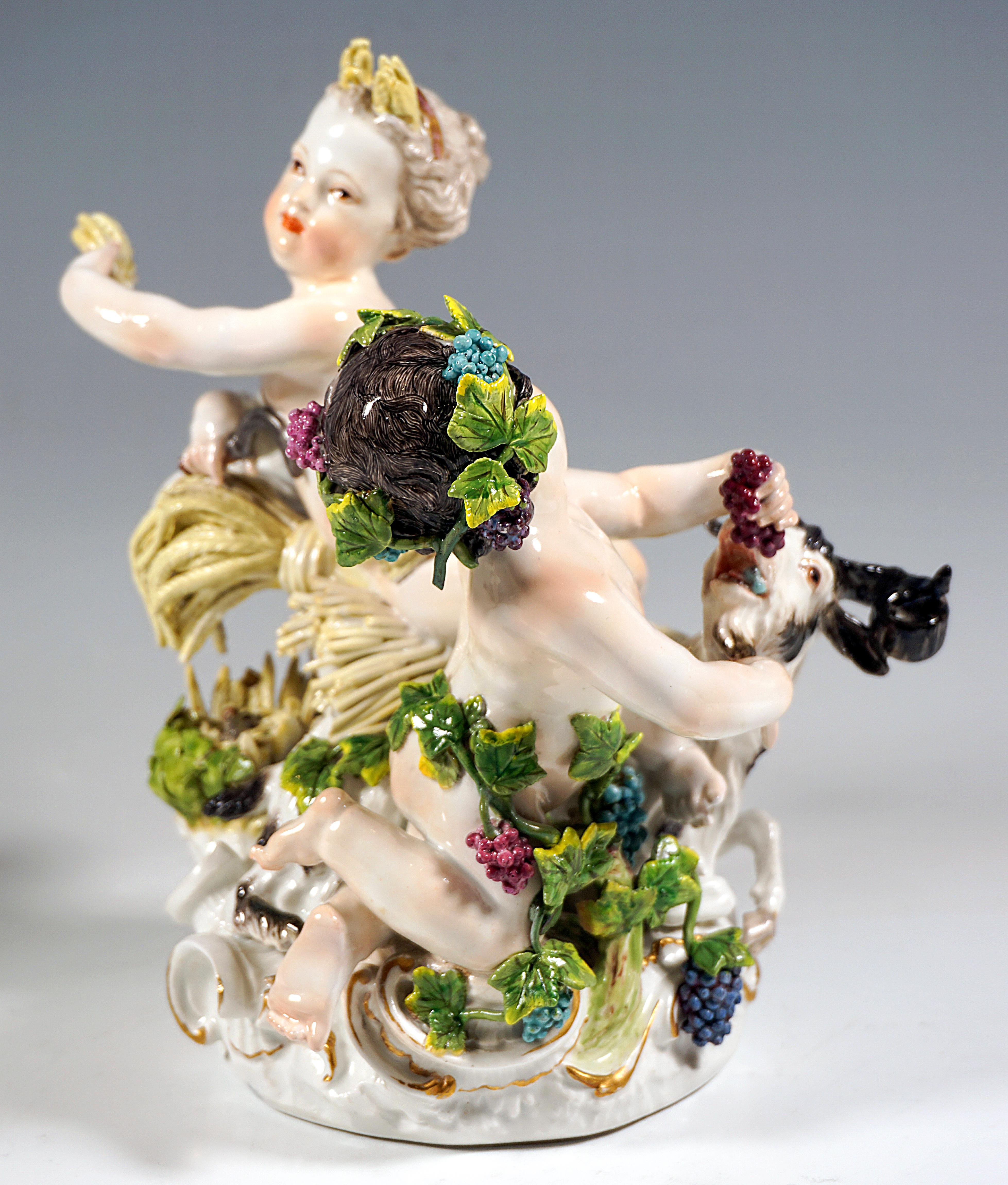 Meissen Porcelain Group From The Time Of Origin:
Two naked cupids and a ram on a rocaille rock, depicting the seasons of summer and autumn:
Summer bedded on a bundle of ears of corn, ears of corn in his hair, holding up a handful of corn, in the