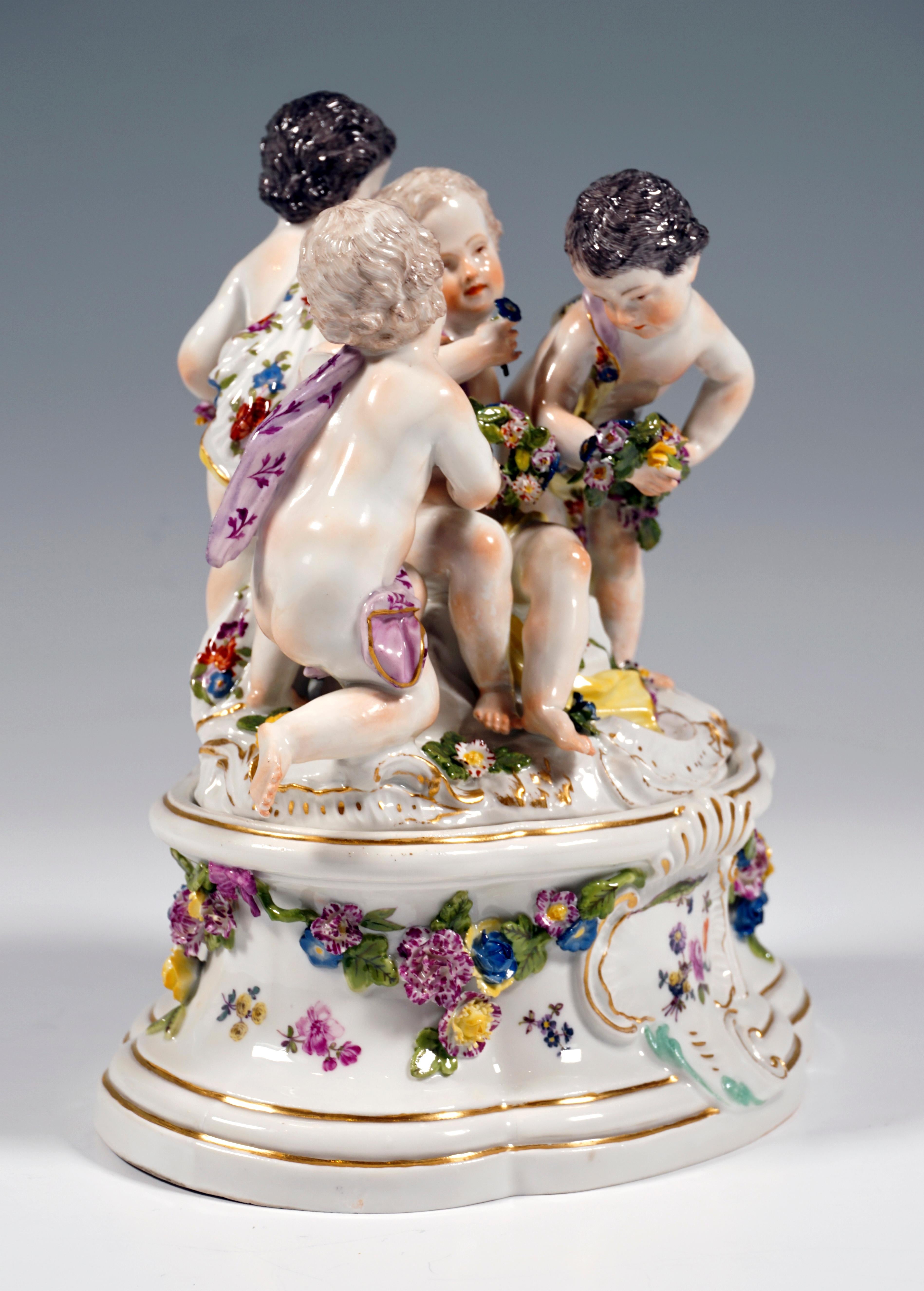Four scantily clad cupids grouped on a rock, partly flowers, partly holding flower arrangements in their hands, the flowers as a typical attribute of the Meissen spring representations.
The group is based on a rock plinth of oval shape with gold