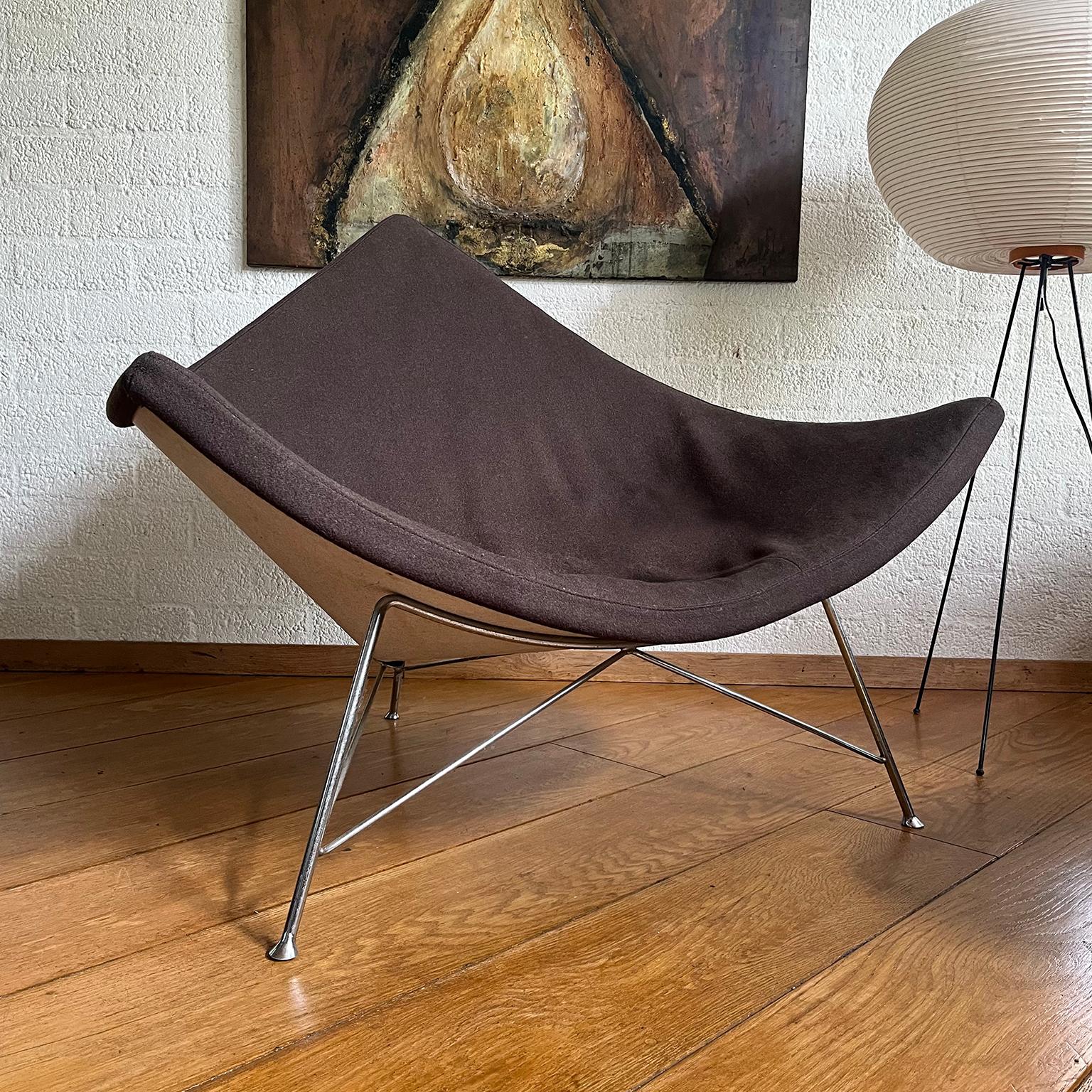 The Shell of 99% of the coconuts is Plastic, This early one has a metal back  and is designed by George Nelson for Herman Miller. Fully restored and upholstered

The super rare, original Coconut Chair is an excellent example of 50's design. The