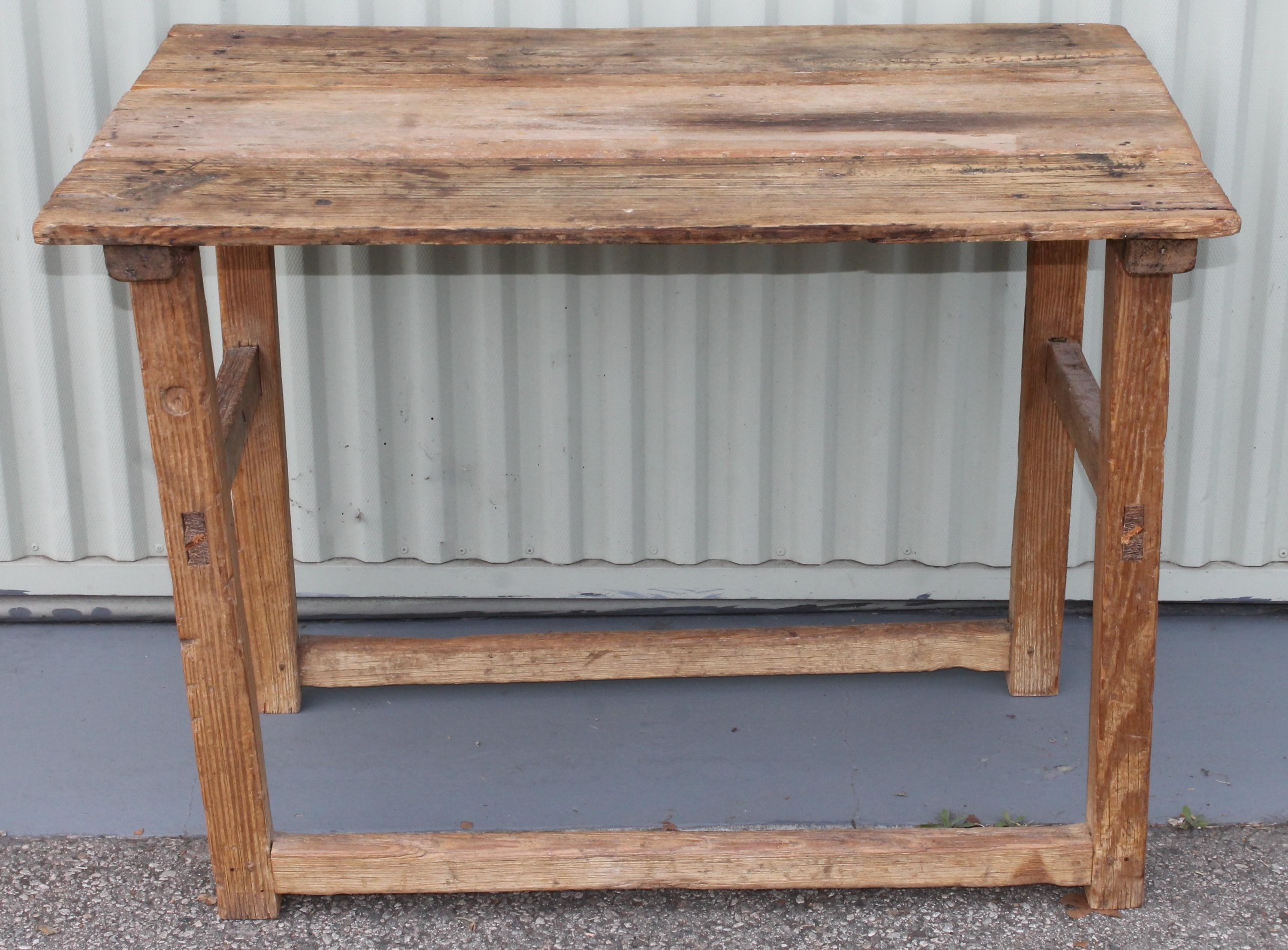 This folky handmade Mexican farm or work table is in great condition and mortised legs construction. This table is in good sturdy condition.