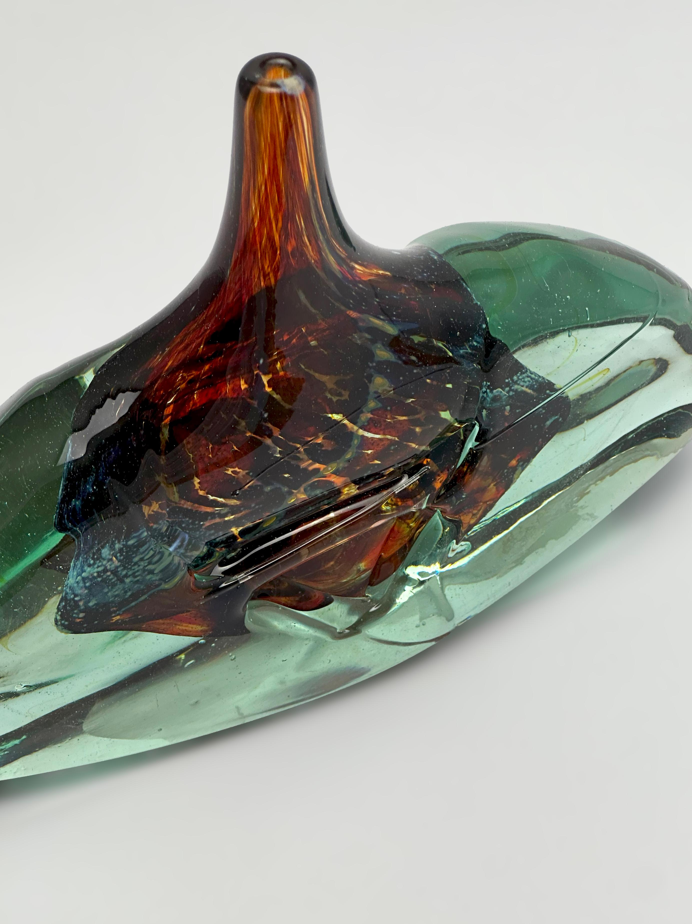 A rare example of early studio work by Michael Harris for Mdina Glass, this sculptural axehead vase was handmade on the island of Malta in the early 1970s. Harris, a pioneer of British studio glass, founded Mdina in 1968 with a vision to bring
