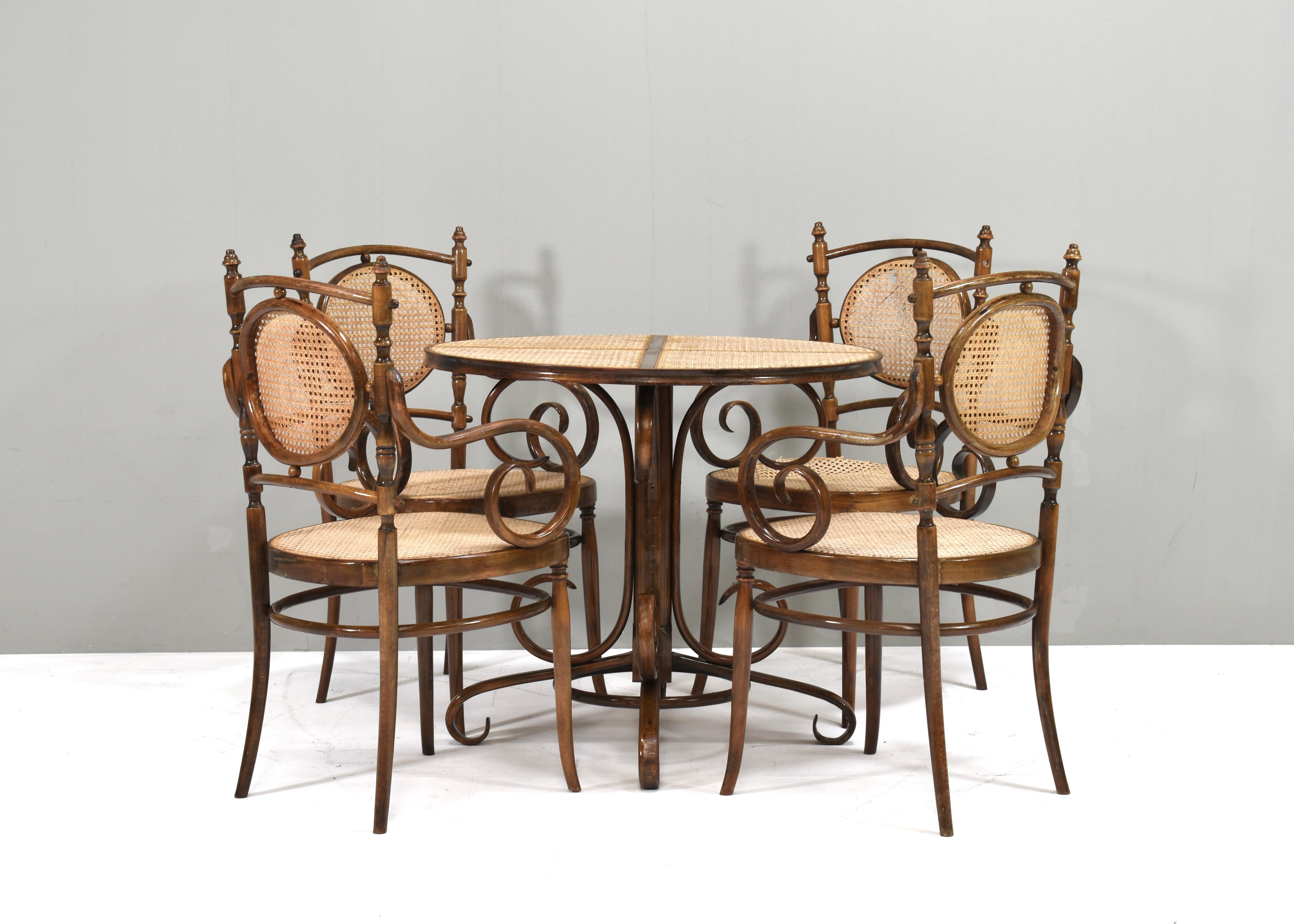 No. 17 dining set in bentwood and cane 'long john' chairs and table designed by Michael Thonet. Originally designed in the 1860s and produced by Thonet in the 20th century by multiple factories.
Size:
chairs: 57x49x96.5 seat height 46 Arm height 67