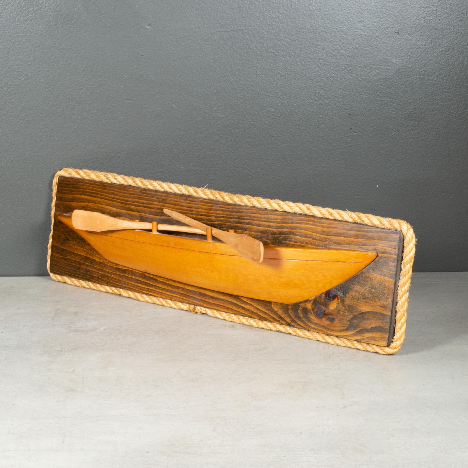 ABOUT

An original hand made half hull with two oars mounted on a wooden plaque bordered with thick rope. Original label on back.  

    CREATOR Cape Cod Ship Models, Rt. 28, Dennisport, MA.
    DATE OF MANUFACTURE c.1940-1970.
    MATERIALS AND