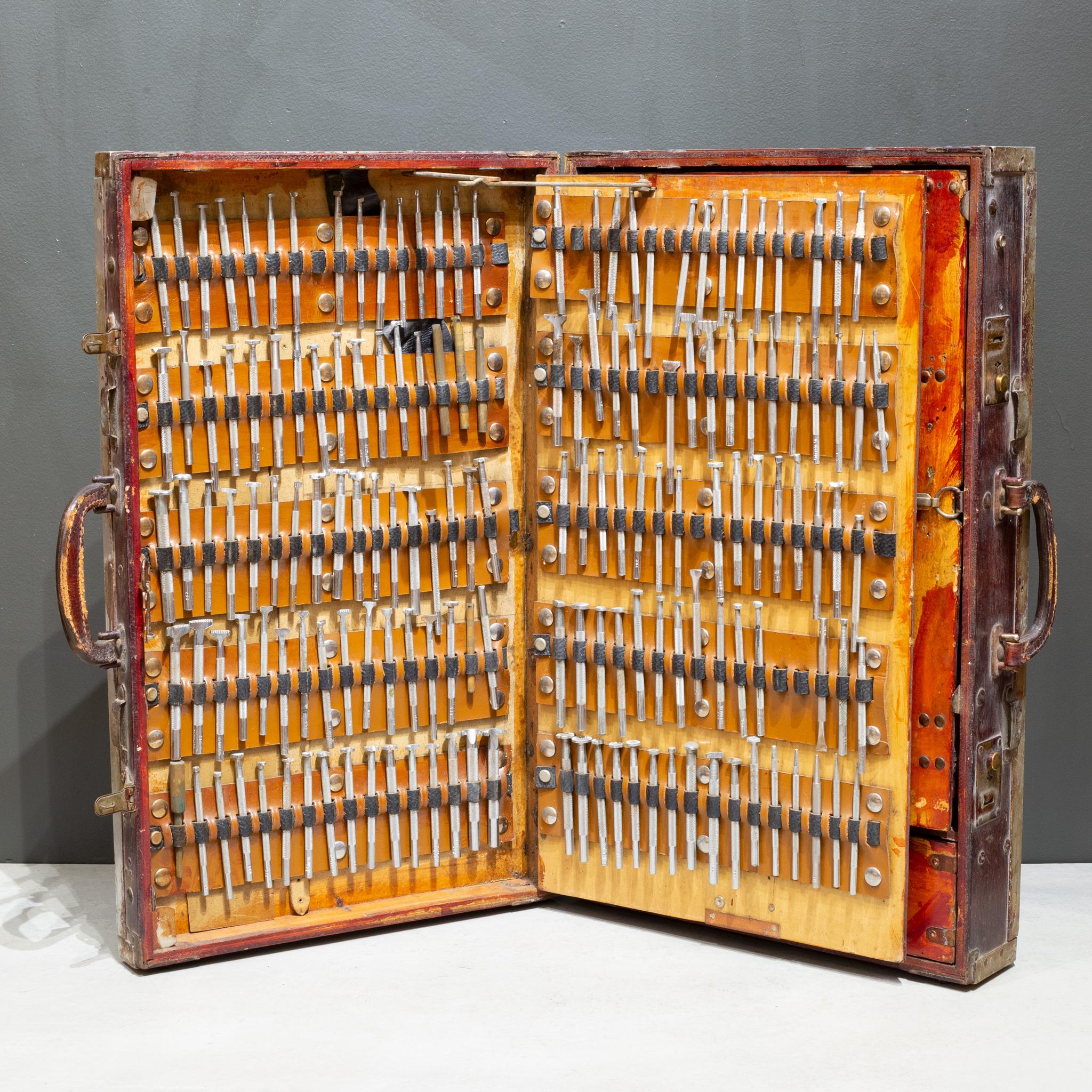 ABOUT

An antique portable saddle maker's wooden tool chest. The wooden chest has two leather handles and solid brass locks. When opened two hinged panels open to reveal multiple tools. The left side has 10 rows of 170 pattern making steel stamps.