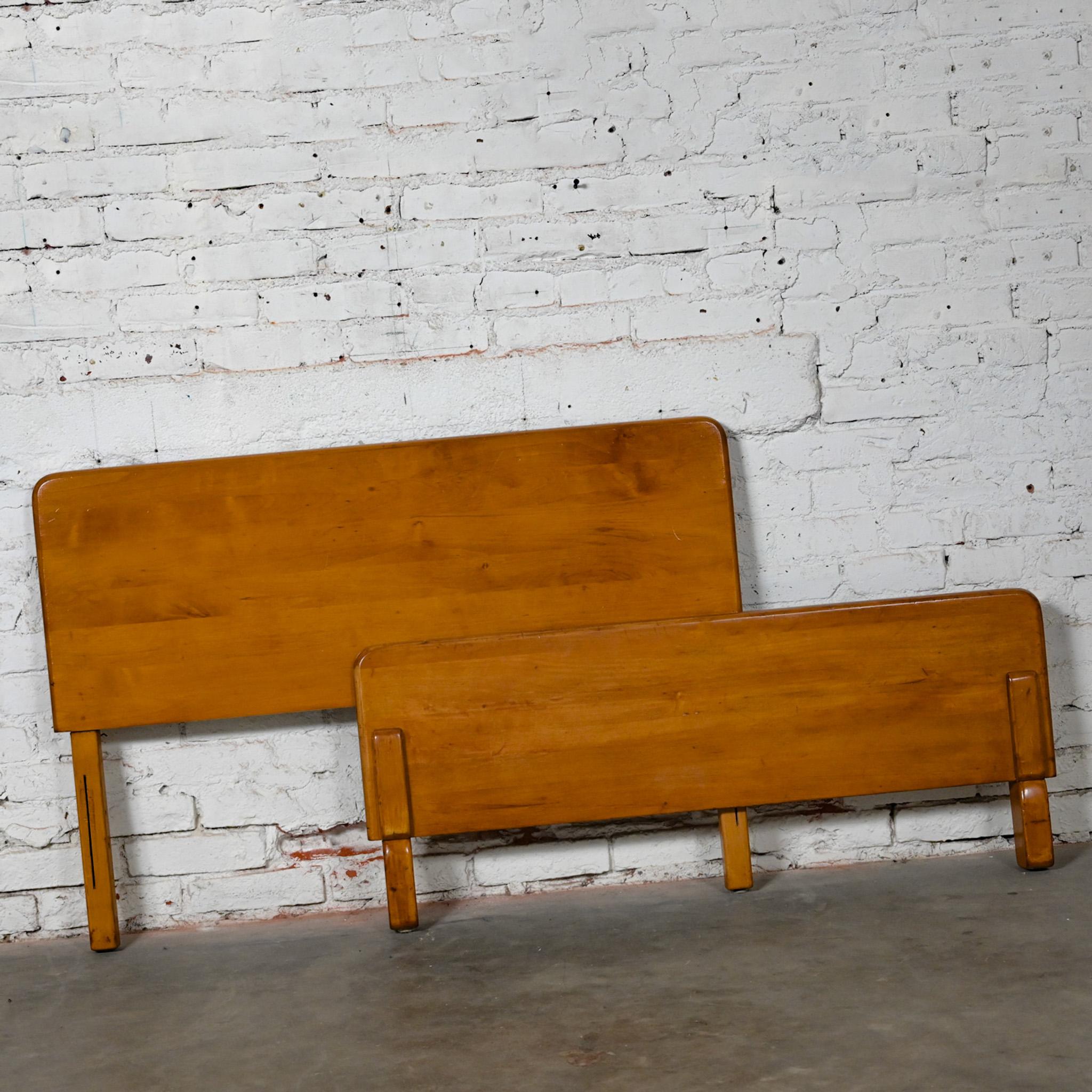 Handsome Early-Mid-20th Century Art Moderne solid maple twin bed headboard & footboard in the style of Bissman and after Russel Wright for Conant Ball. This piece has been attributed based upon archived research including online sources, vintage