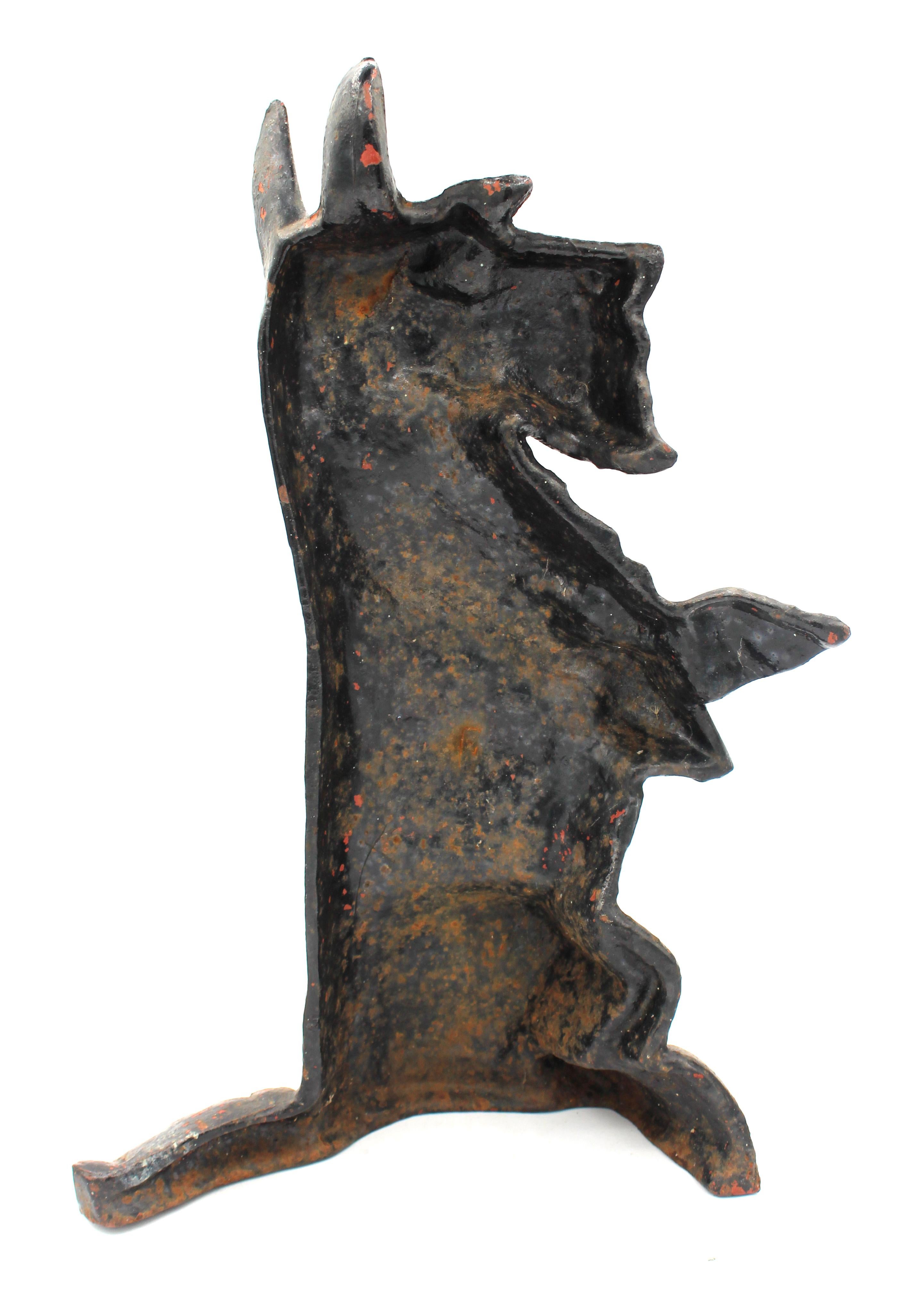 Early-mid 20th century Scottie Dog cast iron doorstop, English. Simply adorable in original black paint with expected wear - sitting up for attention. Well modelled.
14