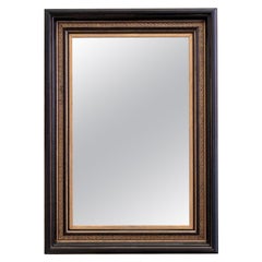 Miroir à clé grecque noir et doré de style Empire du début du siècle dernier