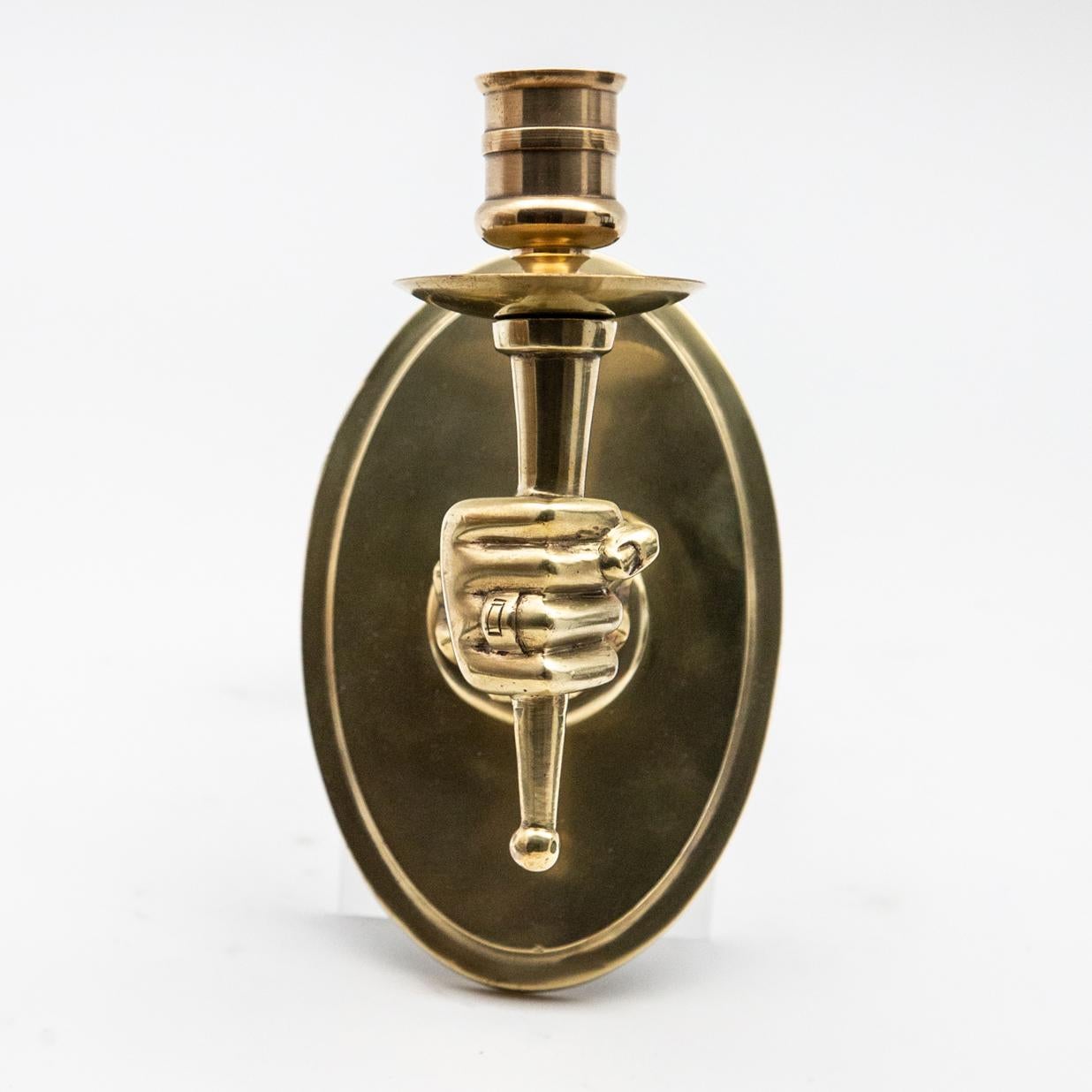 Early midcentury hand holding torch wall sconces. Measures: Brass 7