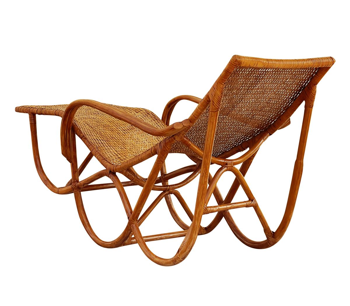 An amazing early bamboo chaise from c. 1940's. It features a bamboo frame with woven seating area. Has been professionally retouched and ready for immediate use.