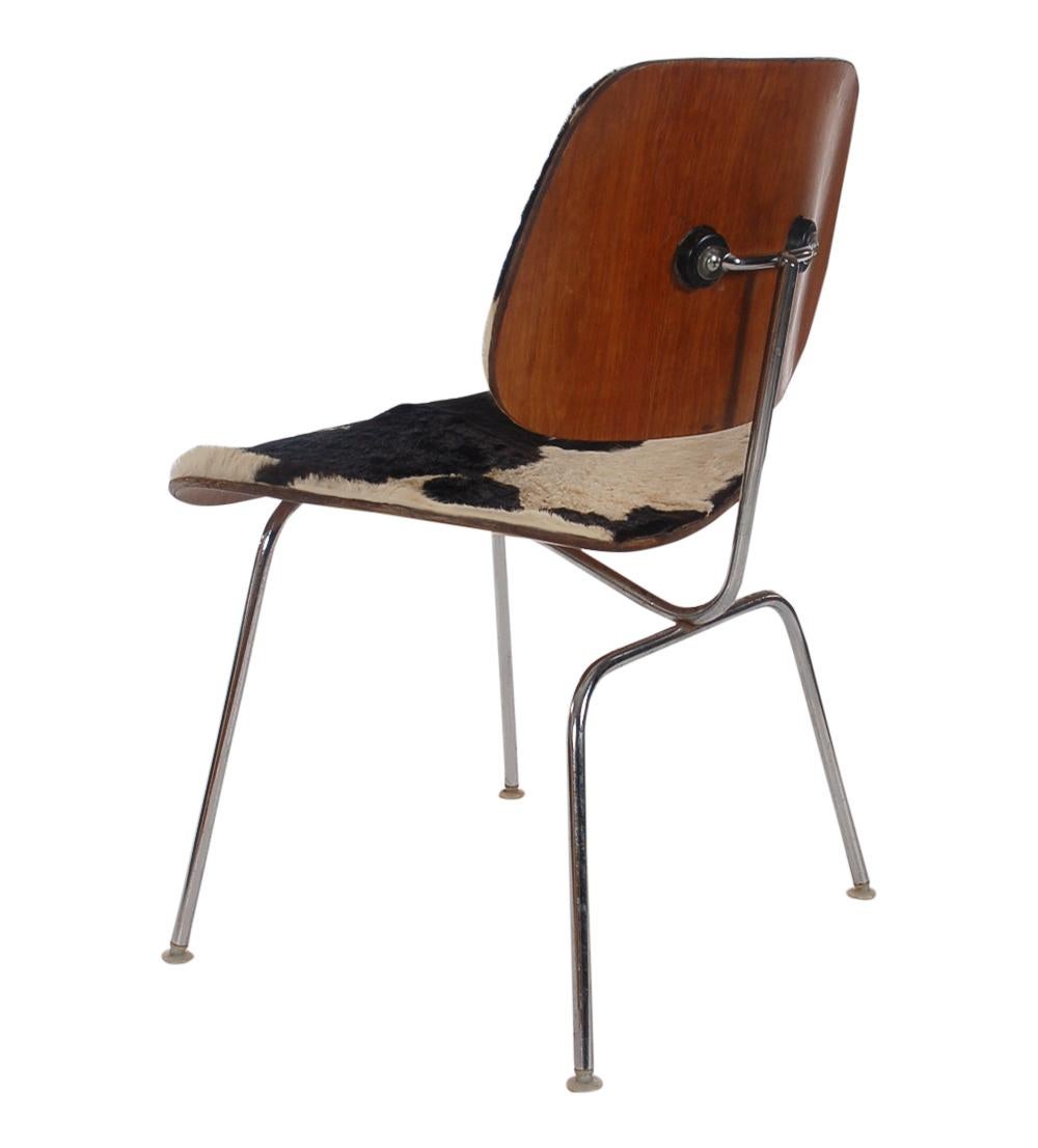Uncommon to find in the wild, here we have a fur covered DCM chair designed by Charles Eames and produced by Herman Miller in the early 1950s. This chair is all original with age appropriate patina.