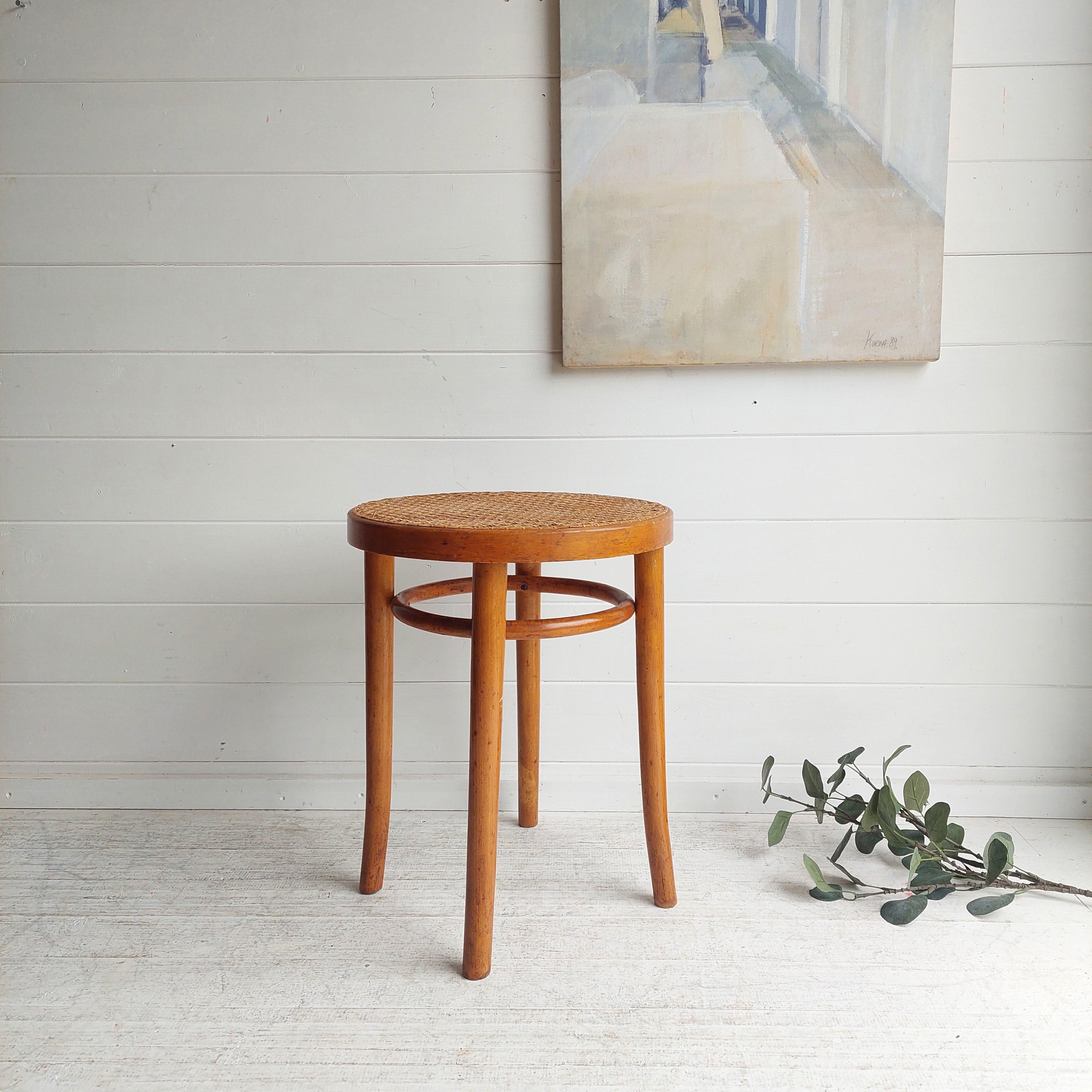 Thonet bentwood stool , model 4601. 1960s Wicker .
This is probably produced in the the late 30s early 40s.
A bentwood stool possibly produced by Thonet. 

A classic bentwood stool with cane seat,  probably handmade in Poland. 
Beech frame and legs