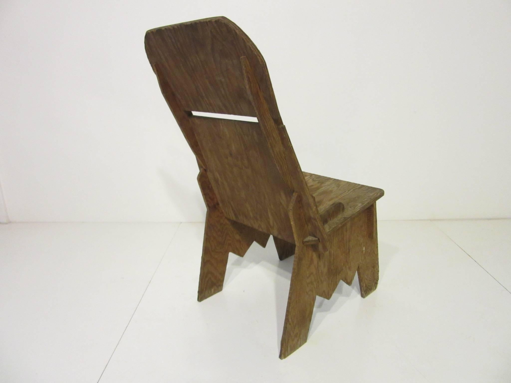 A very early birch plywood designed chair made with interlocking pieces, in the manner of innovators like Frank Lloyd Wright and Grabe using plywood as a furniture product. The chair is still usable and amazingly comfortable to sit in artist and