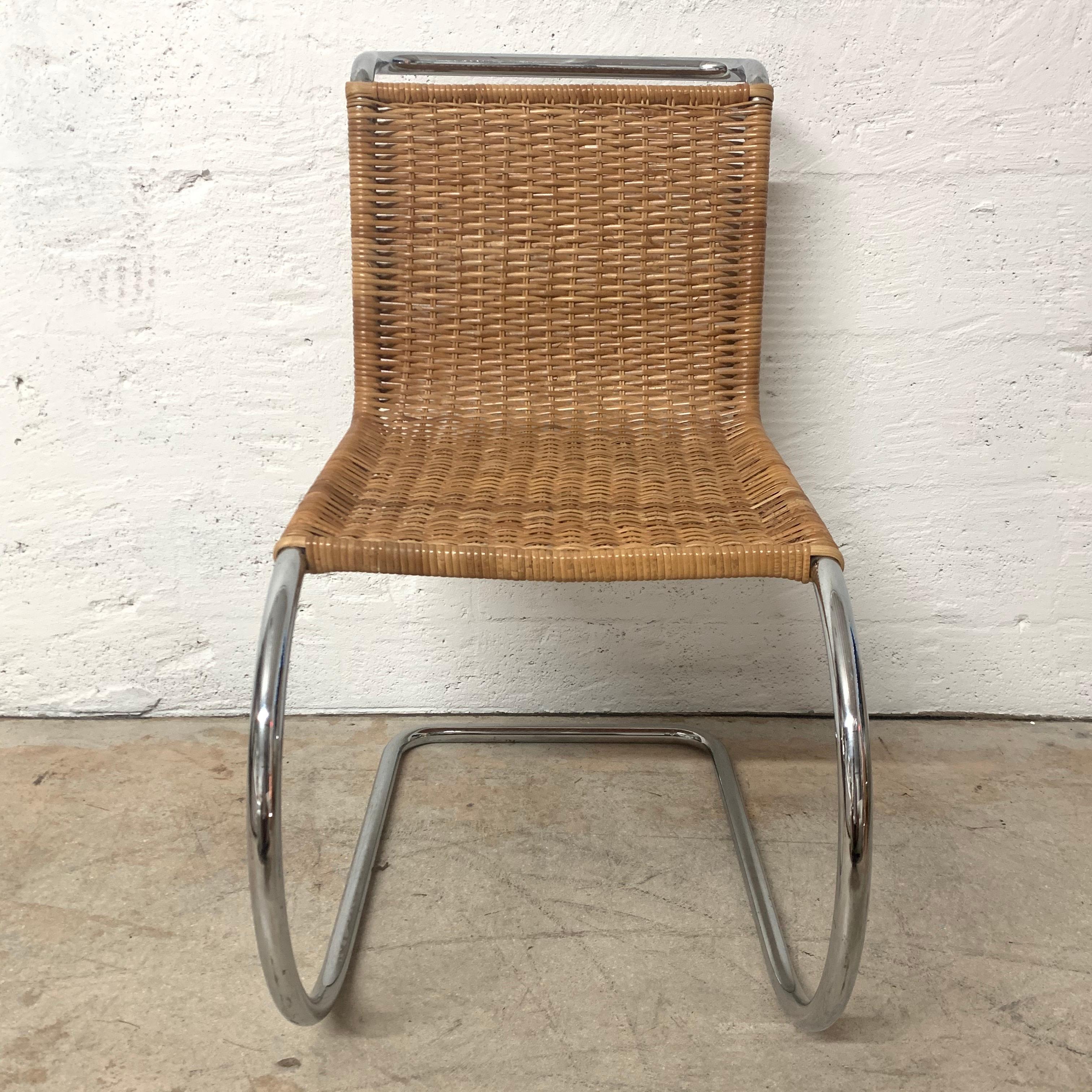 Early MR 10 side chair rendered in chrome-plated steel frame with woven cane wicker seat designed by Mies Van Der Rohe, produced in Italy, 1950s.