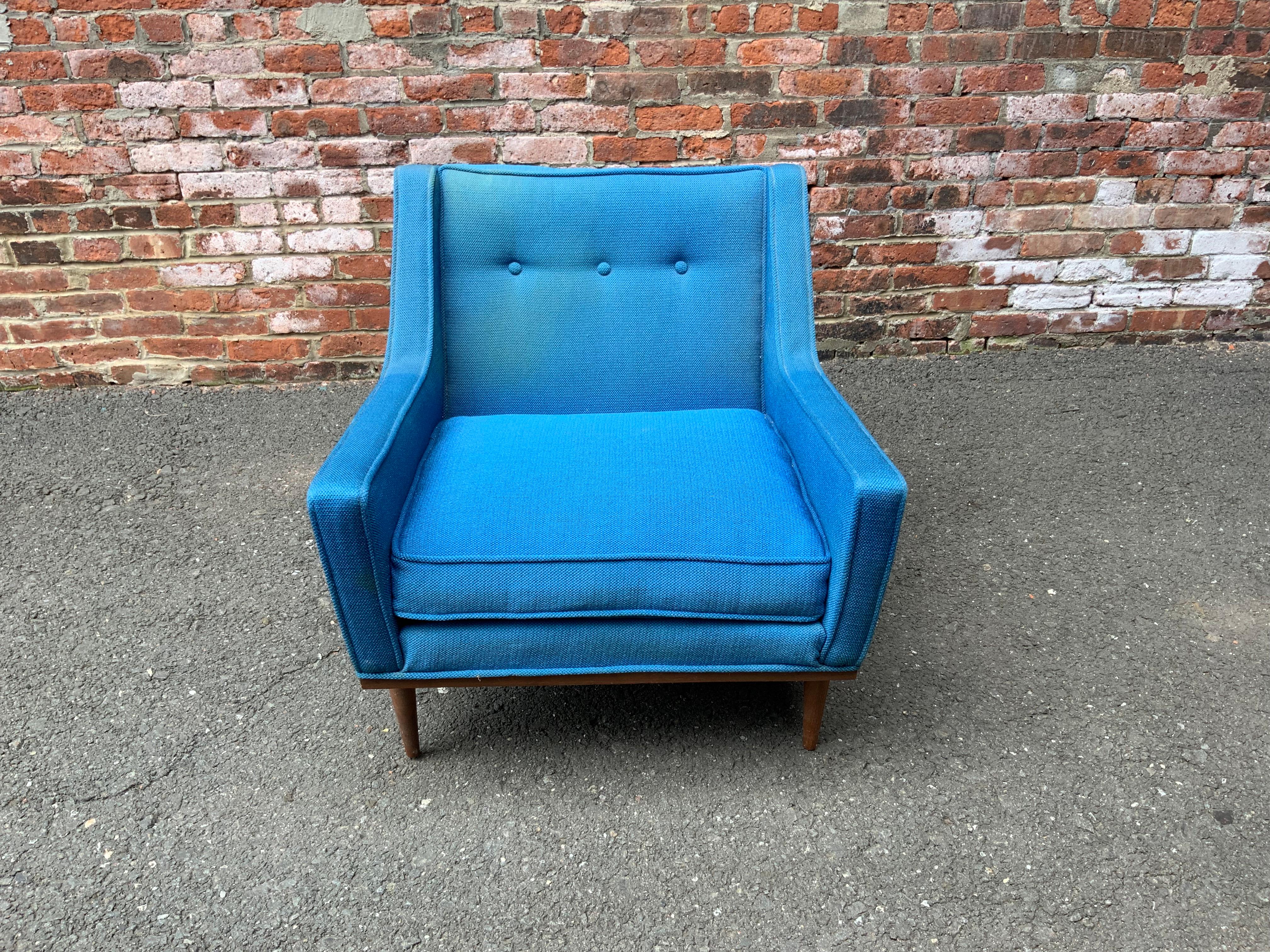 Early Milo Baughman for James Incorporated, High Point, NC. Amazing original royal blue wool upholstery with walnut platform base and legs. Original tag on the base. The angular profile lines just make this chair. Good condition with some minor