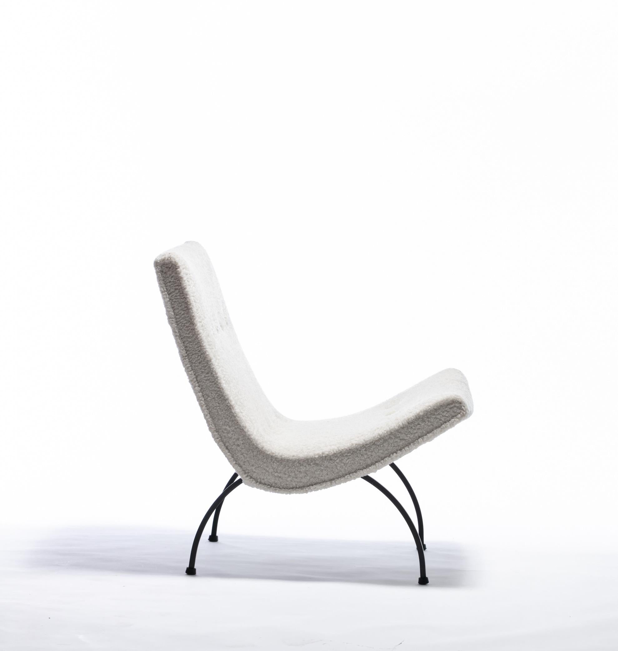This Milo Baughman Scoop chair is luxuriously upholstered in ivory Shearling upholstery which adds a wonderful texture to the Minimalist profile. Elegant and chic in its simplicity, the iron legs are substantial yet wispy as a line drawing. The