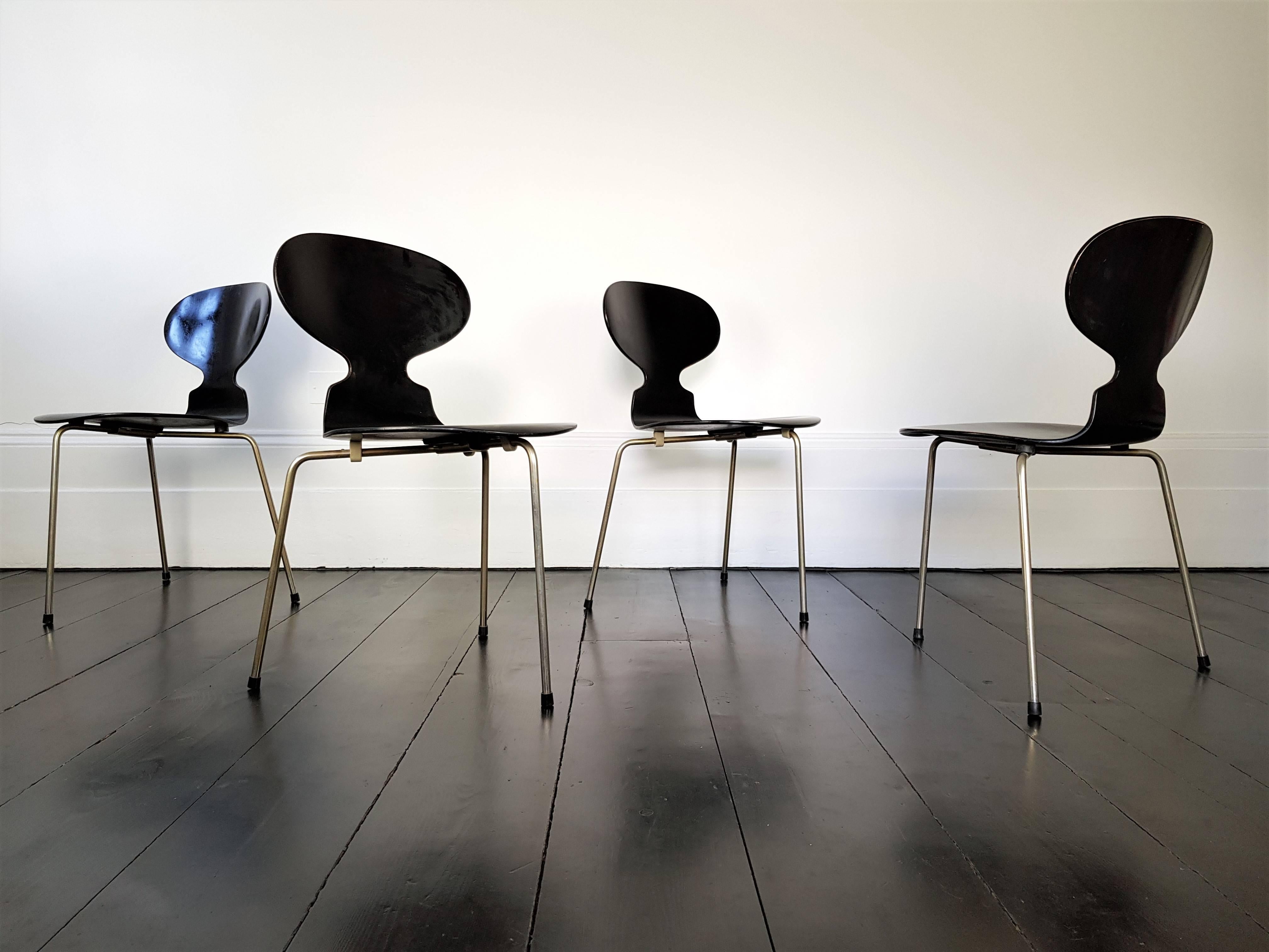A set of Iconic Model 3100 'Ant' chairs by pivotal Danish designer Arne Jacobsen for Fritz Hansen. The 'Ant' chairs were designed 1952. This set consisting of black lacquered bent wood on a steel frame. 

SHIPPING: We provide very competitive global