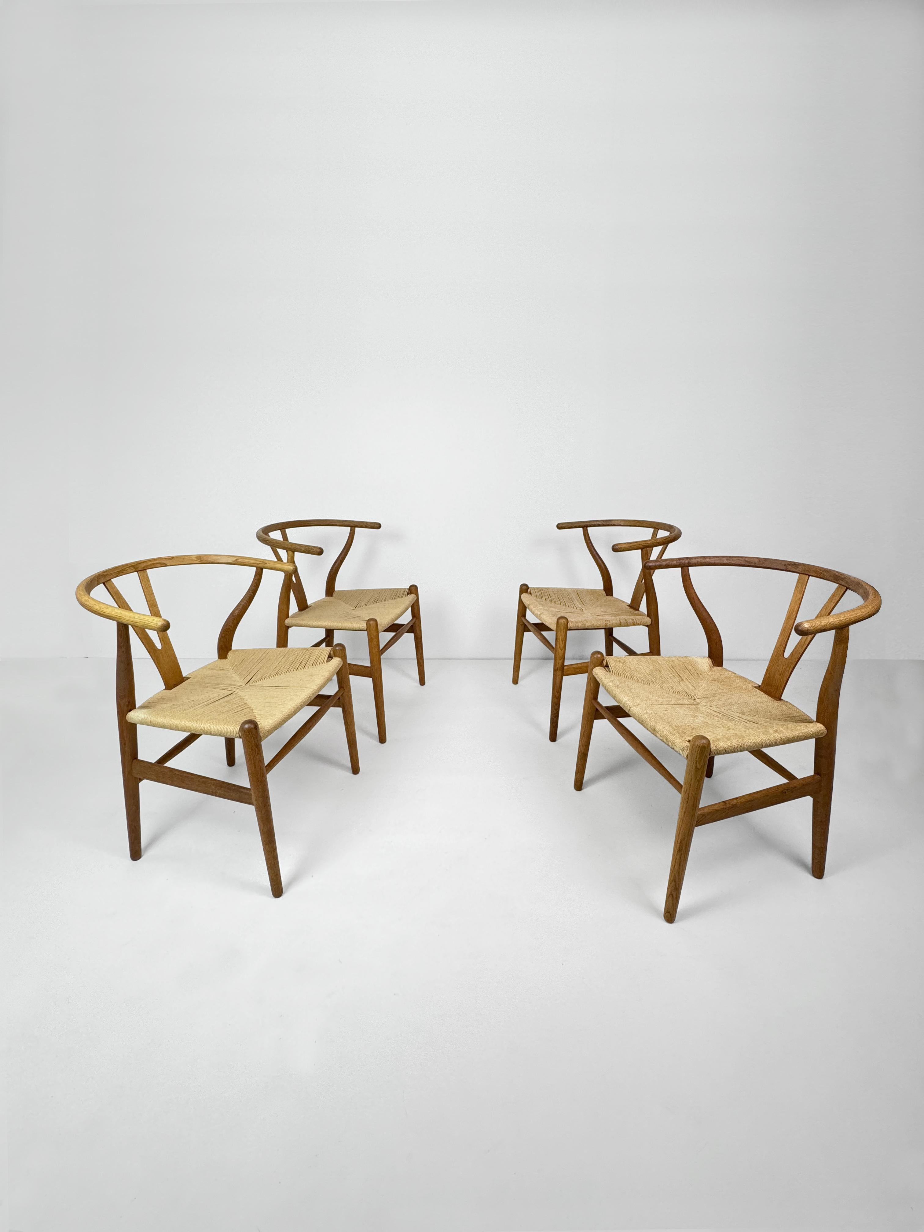 Set of 4 chairs model CH24 in Oak and Danish Paper Cord, designed by Hans Wegner in the 1950's for Carl Hansen and Son, these particular set of 4 are manufactured in the 1970's. The paper cord seat covering in very good condition and the natural