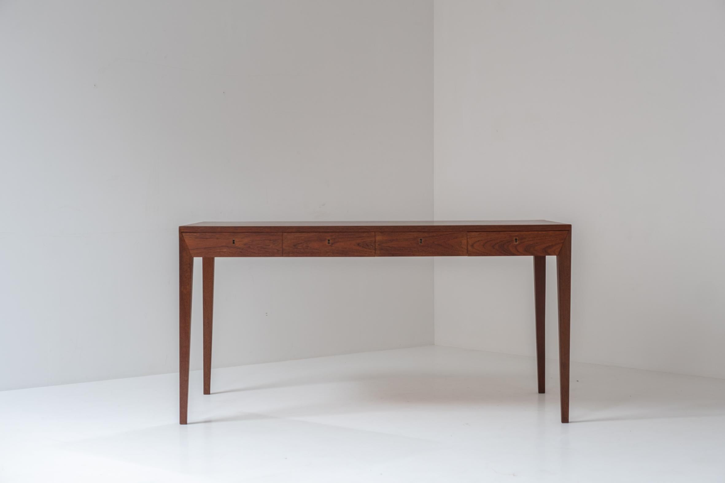 Early Model No. 36 desk in teak by Severin Hansen for Haslev Møbelsnedkeri, Denmark 1958. This freestanding desk features four marvelous shaped drawers and is fully restored with love. It also includes the original key and invoice from 1959 (!).