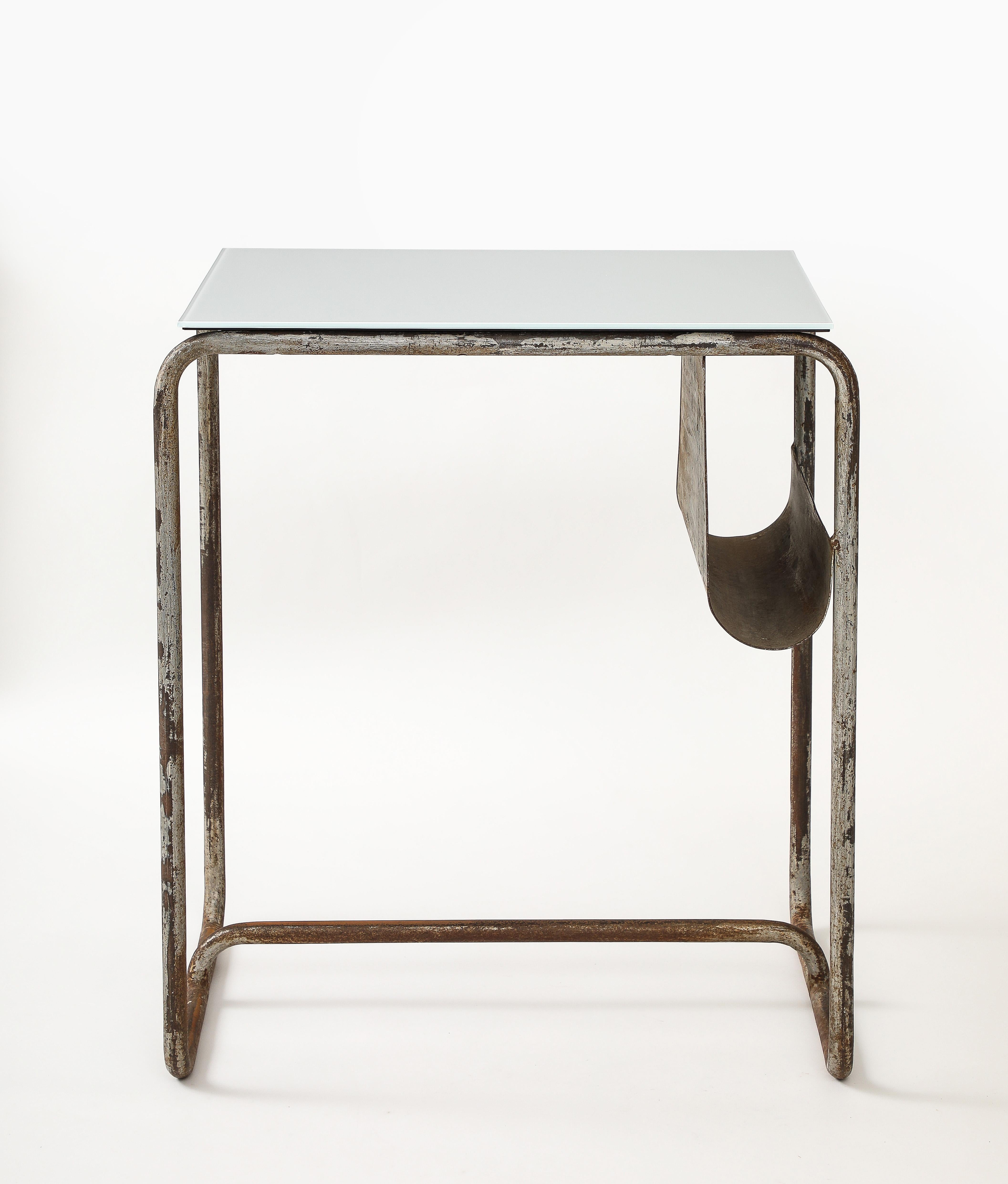 Early Modernist Desk Side Table, Nickel Patina, Opaline Top, France, c. 1920

Excellent example of early tubular furniture.  New Opaline Non Tempered Glass Top.  Side Magazine  Paper Storage